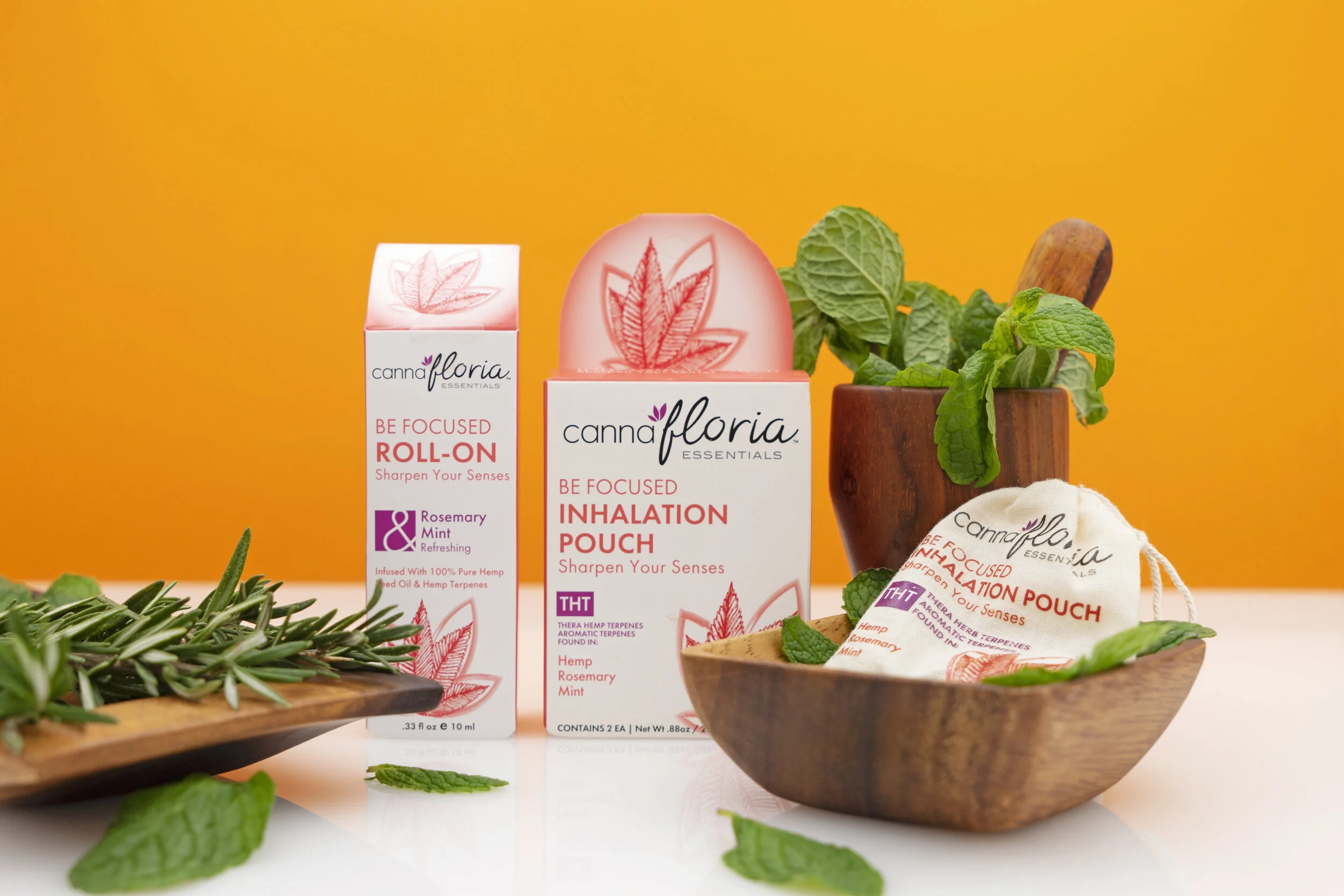 California cannabis product photography featuring Cannafloria packaging on orange background