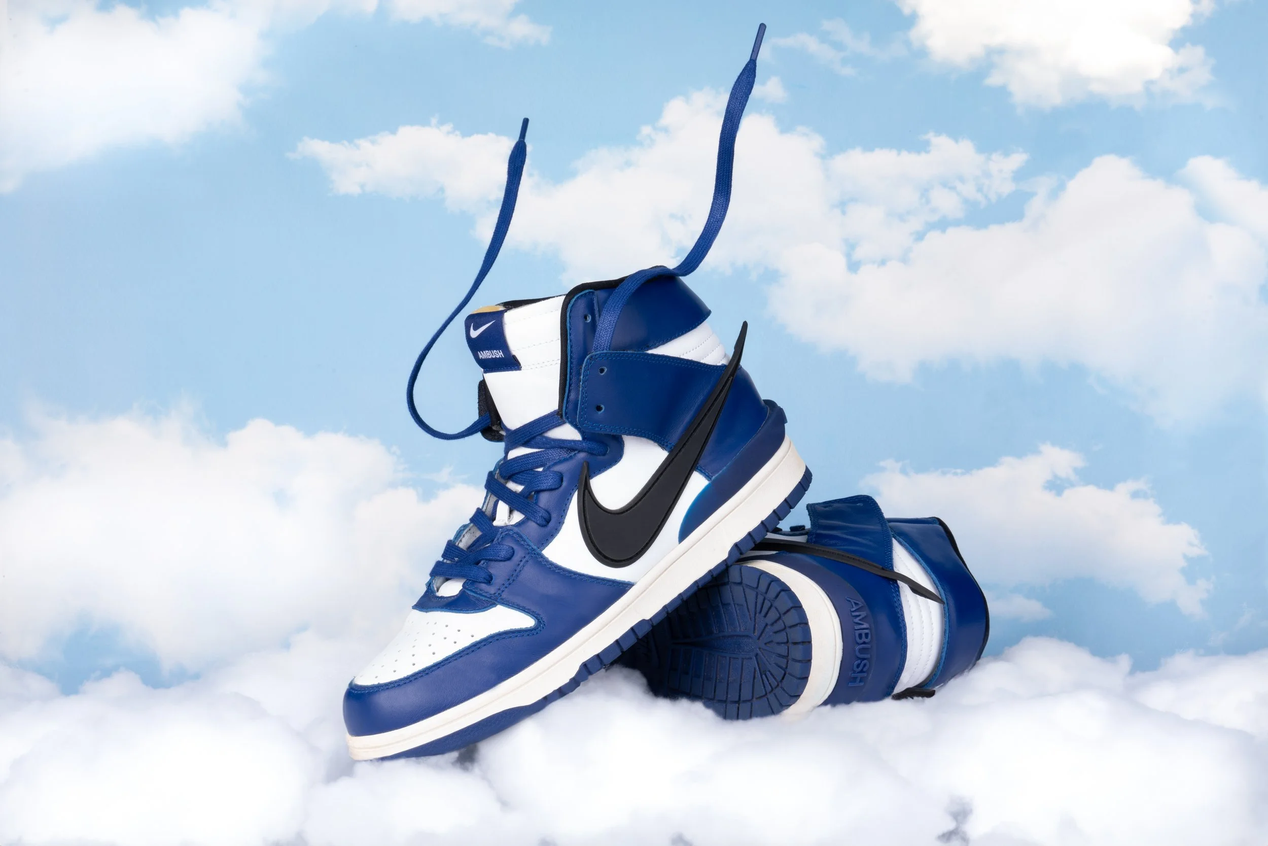 Nike campaign photography against a blue sky background