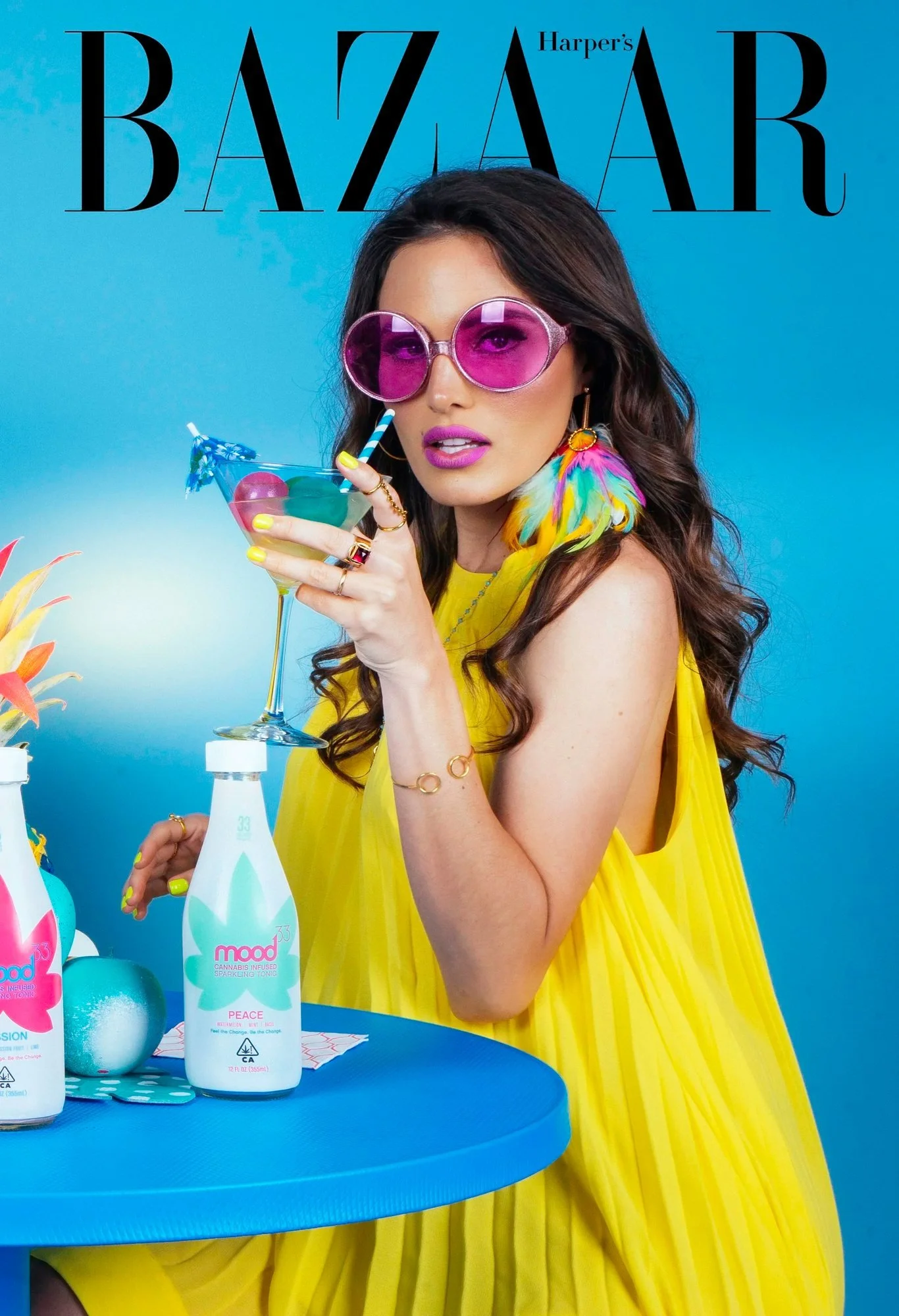 Model in a yellow dress and pink sunglasses with a cocktail, Harper's Bazaar editorial cover