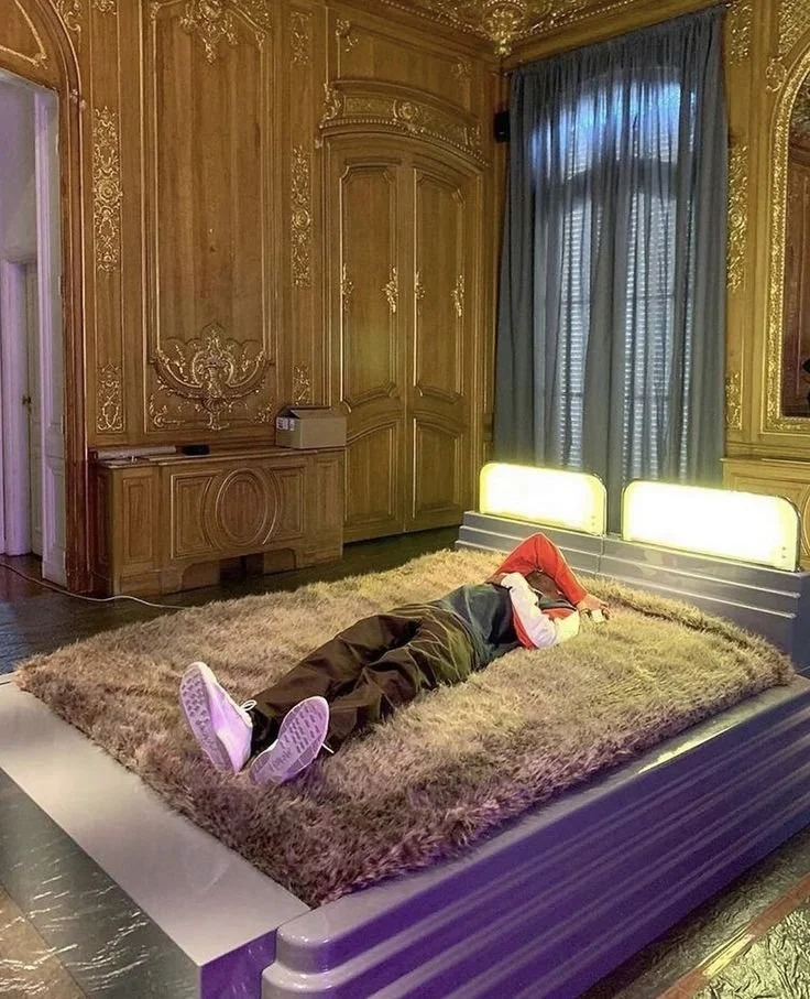 Frank Ocean laying on Ettore Sottsass' Eledue bed