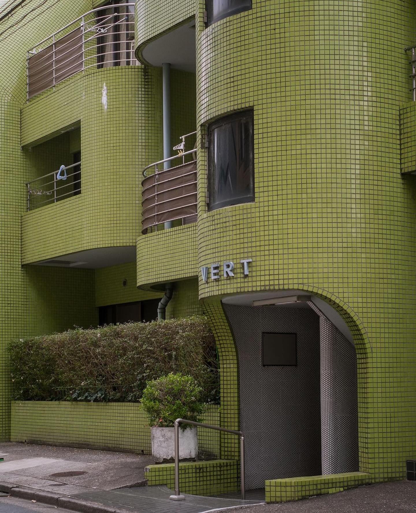 Avocado green tile wraps around VERT Akimoto, an  apartment building built in 1982 in Nakano, Japan 🥑 via @japanpropertycentral