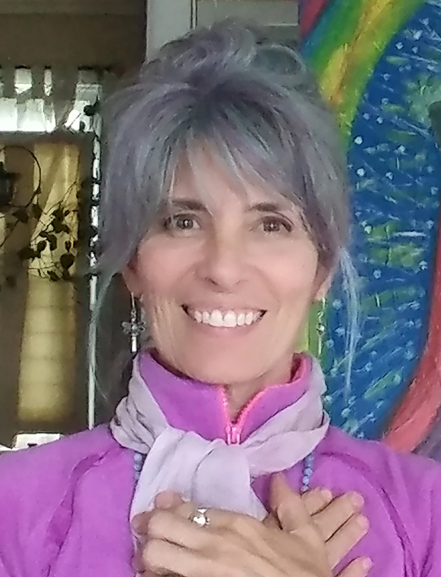 Rose Marie Escobar wearing a pink sweater and scarf