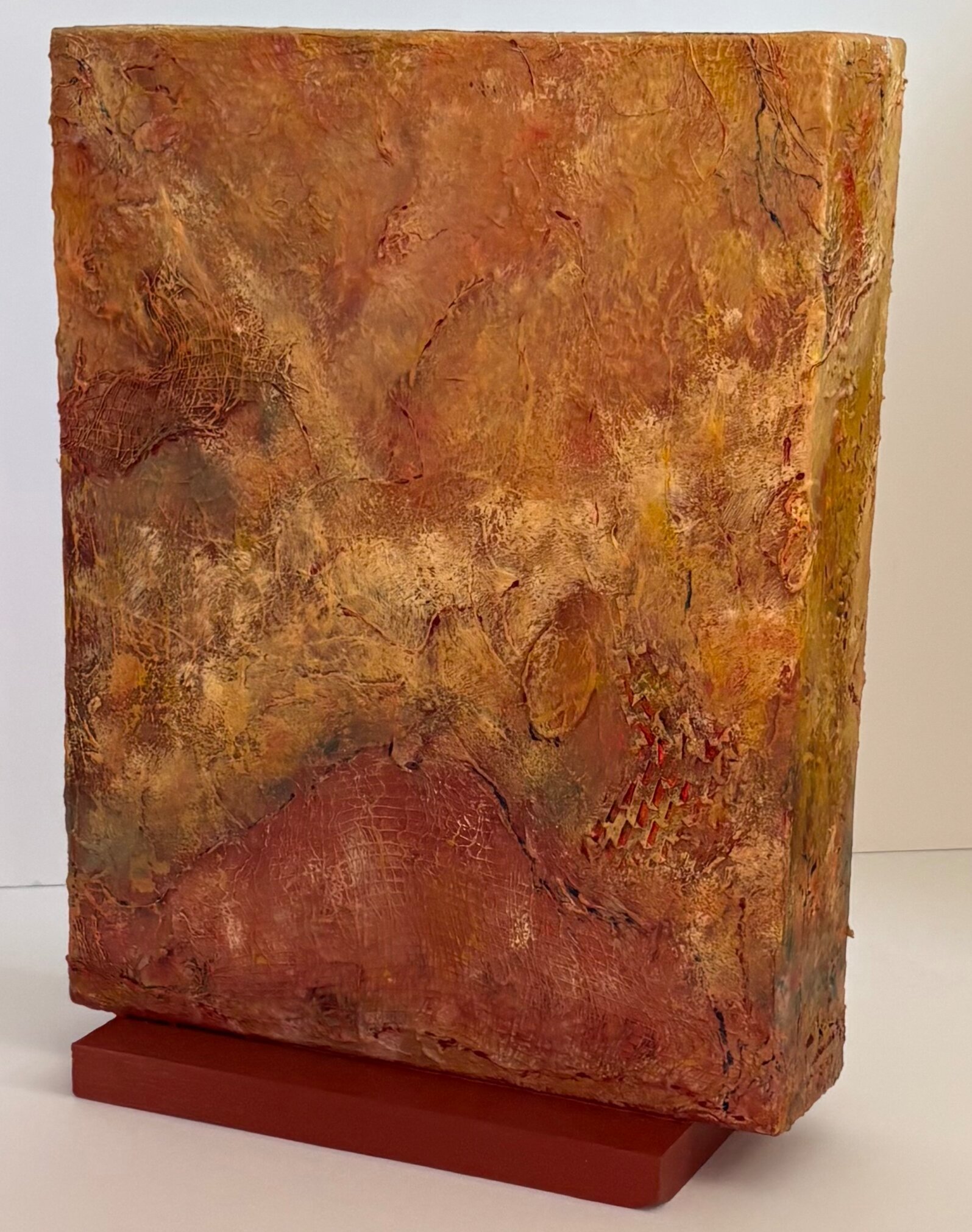  Iria DeValles-Vieira   
 Under the City   
15" x 11" x 3" 
Acrylic Mixed Media Under the City was created by joining two cradled panels together to form a deeper, four-sided structure. The added depth suggests something hidden — a space beneath the 