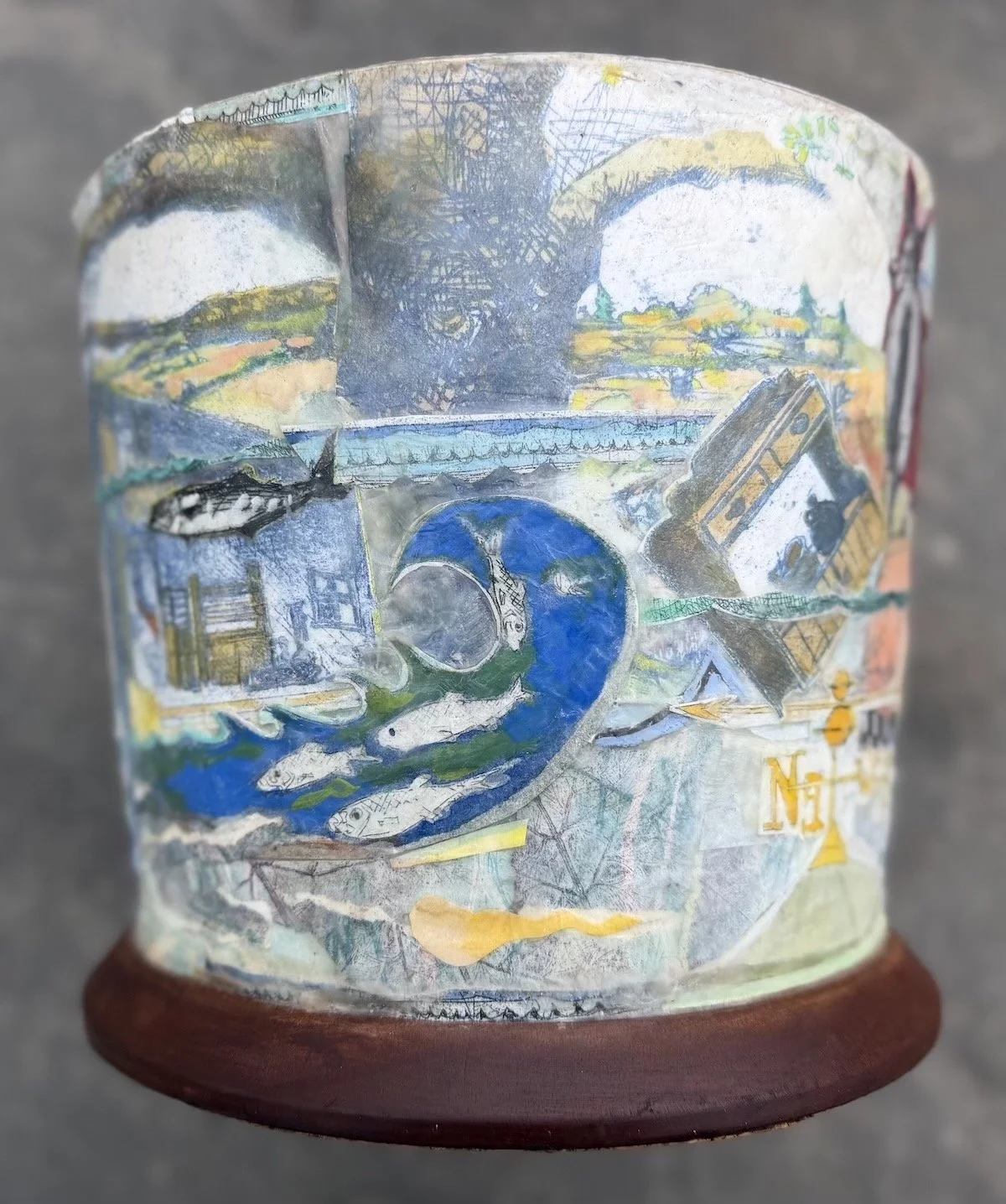  Josie Richmond   
 Water's Rising! Climate Change ice bucket   
10" x 10" x 10" 
Etchings w/encaustic on recycled ice bucket The ice bucket has been waiting for its moment for a few years.   Fire and Ice seem to go hand in hand. 
