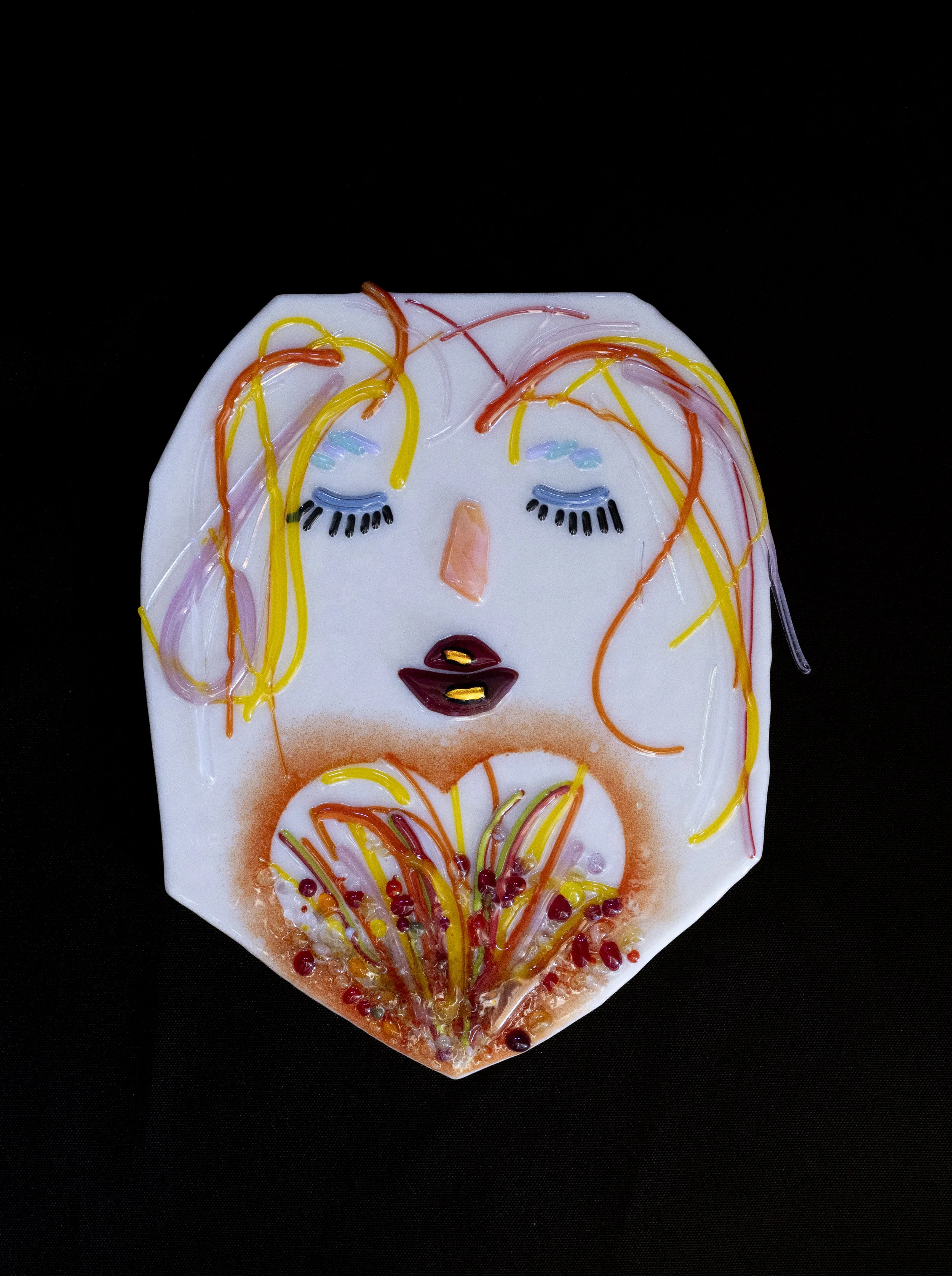  Sherri Feld Sousa   
 Circle of Fire and Family   
6" x 7.5" 
Fused Glass This fused glass piece honors three generations—my Mom, my Daughter and I—each connected through a shared creative spark. The layered glass colors and varied textures symboliz