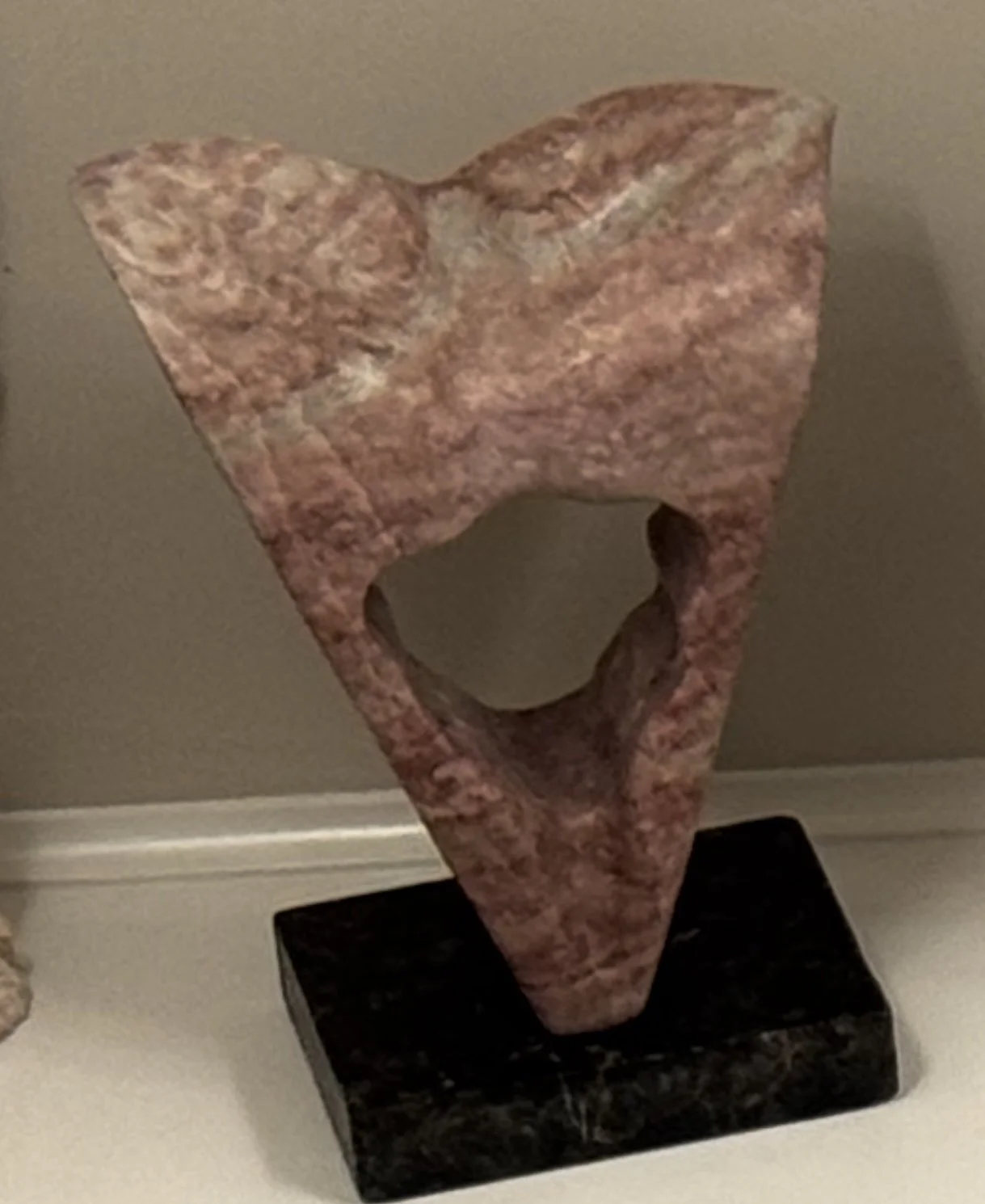 Hope Is a Triangle, 12" H x 7" W x 4" D, cheesecake alabaster mounted on a black soapstone base