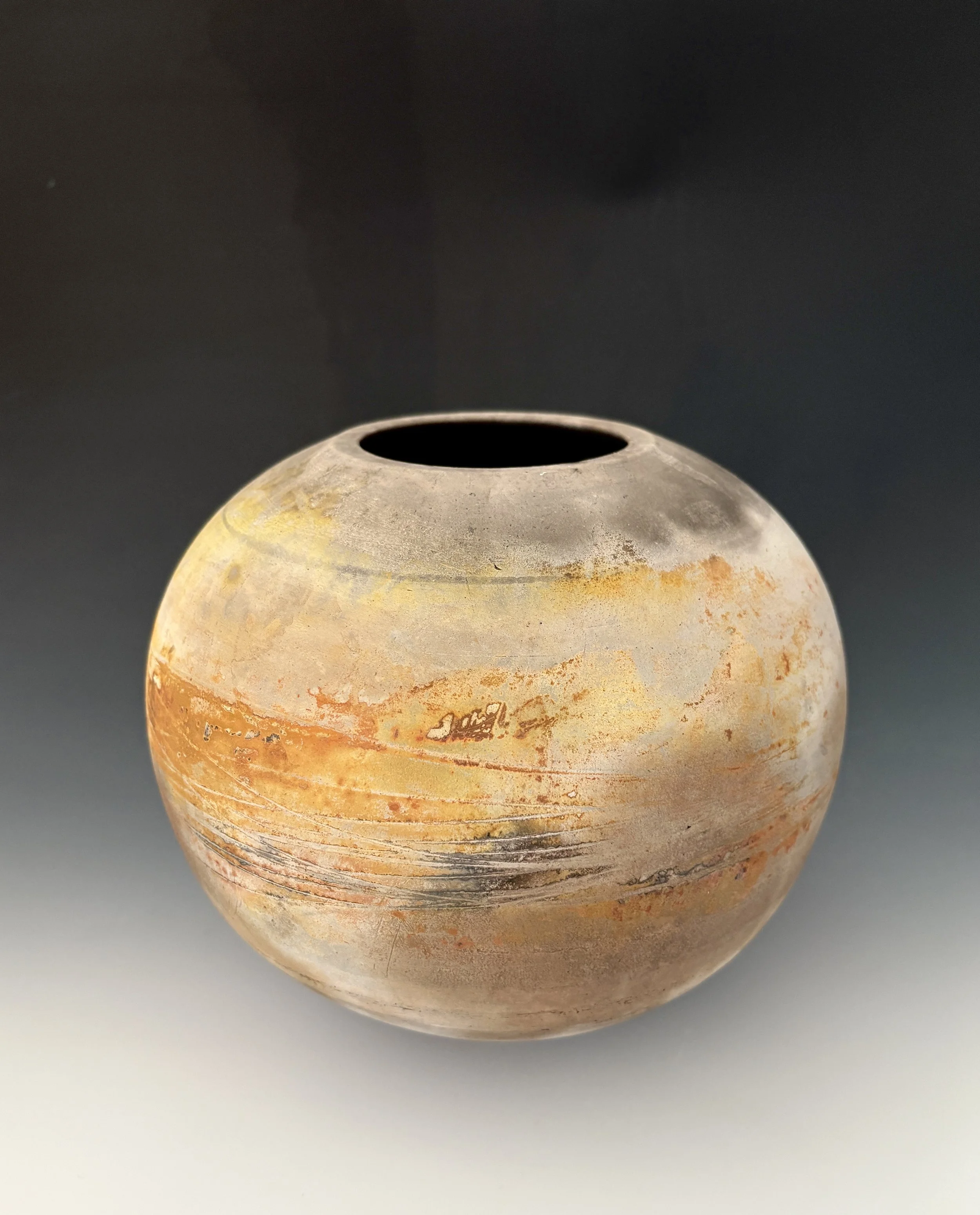  Cali Almy   
 Fire Rings Vessel   
8" x 8" x 8" 
Clay There is always a little magic involved with ceramics, particularly when exploring surfaces.  Whether through the process of glazing or via a certain type of firing, results can often be a calcul