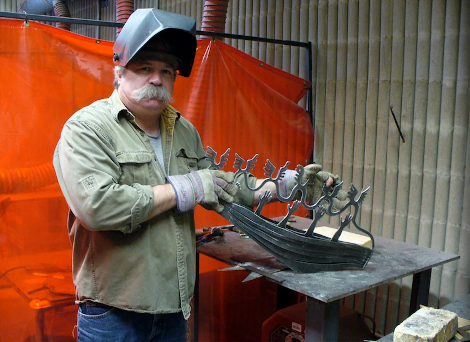 Eric Lintala working on a metal sculpture