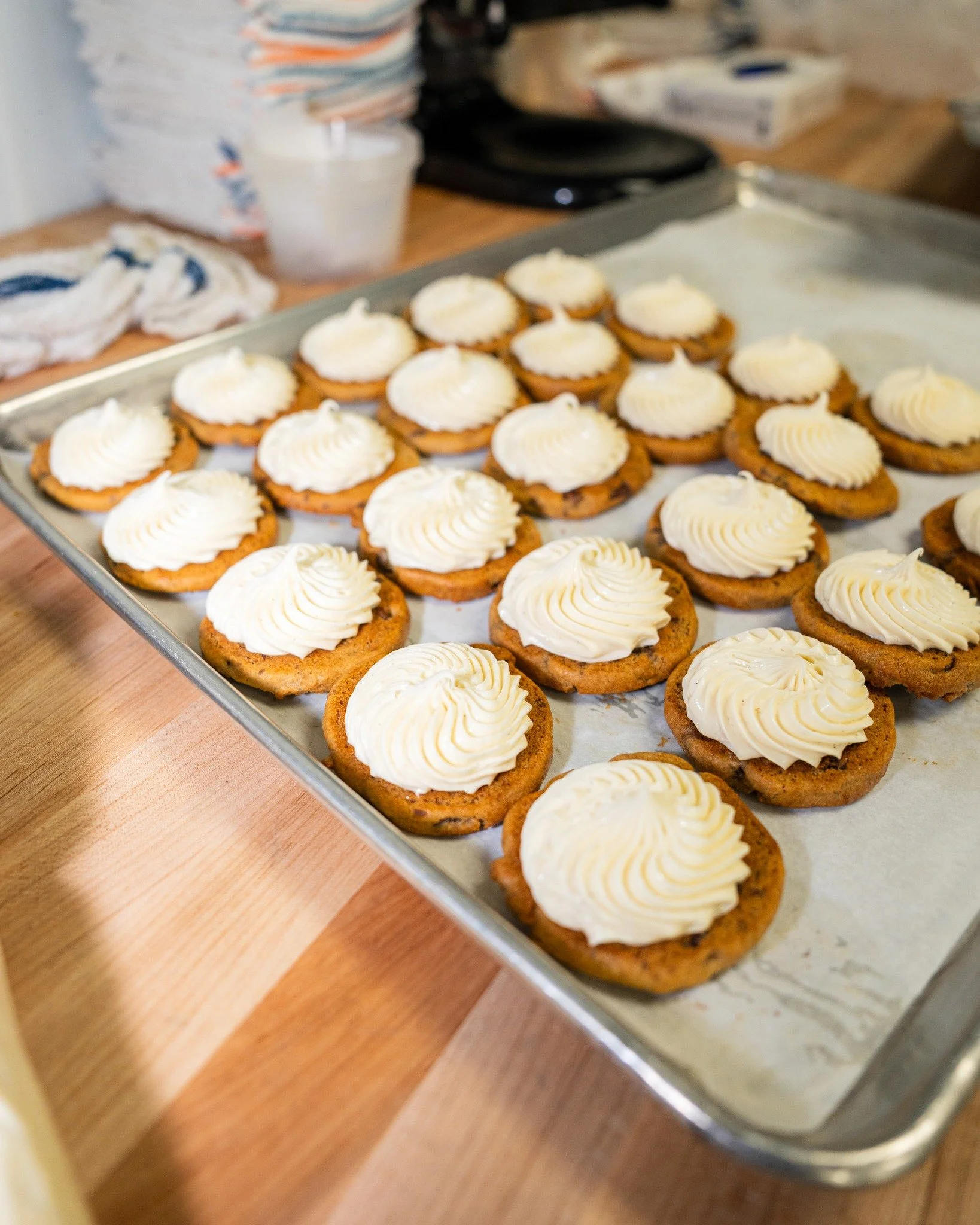 Our Cheesecake Buttercream is truly like our &quot;secret sauce.&quot; We love incorporating it into our cookie sandwiches, our cheesecakes as a topping, and our pineapple upside-down cakes too! 🍪🍰🍍

See Kylie here whipping up a batch of our Choco