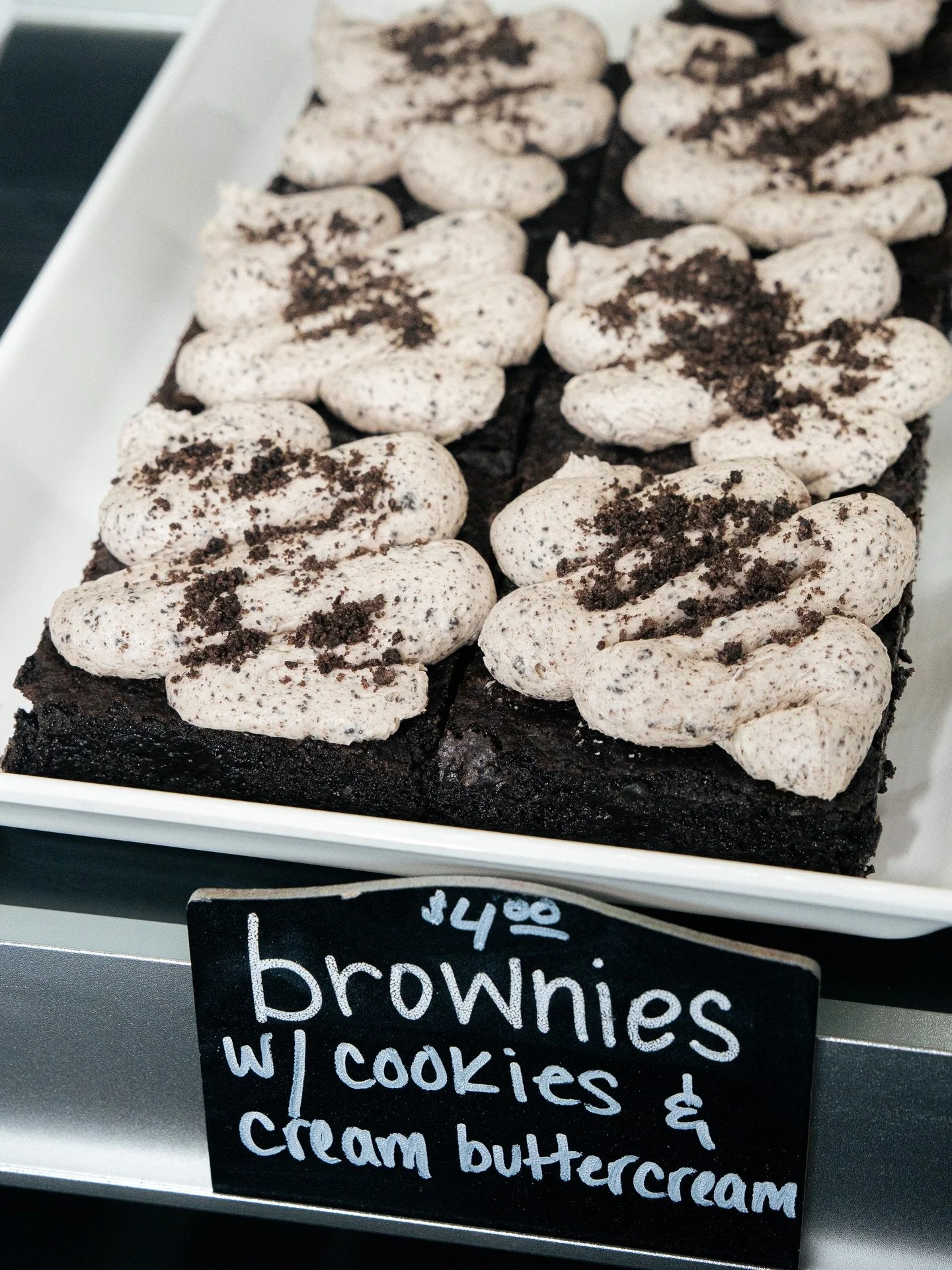An in-house favorite &mdash; our brownie with cookies and cream buttercream takes the brownie experience to the next level. We have milk in the fridge too, you might want to grab some! 🥛 

#brownie #brownielovers #cookiesncream #bakery