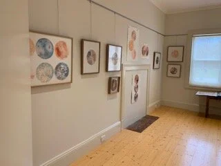 Framed prints on display at a recent gallery exhibition.