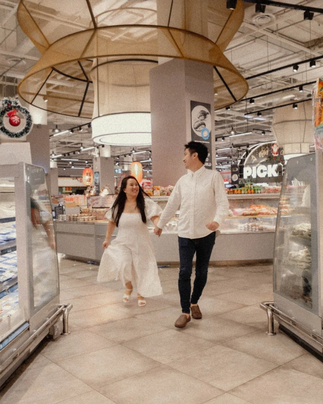 Not every love story needs a grand backdrop.
Sometimes it happens between aisles,
under fluorescent lights,
with oranges held up like props
and rain-soaked railings by the water.

Ordinary places.
Extraordinary days.

Mingliang &amp; Eugenie.

#house