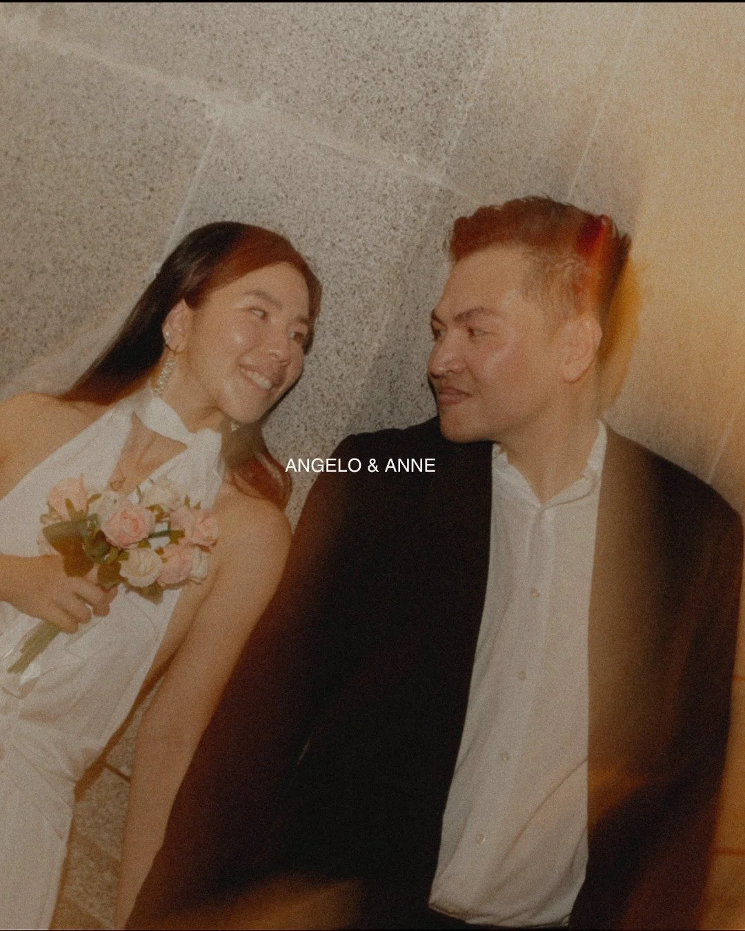 some love looks best at night 
streetlights turning into streaks as you walk 
a pause on the steps, a glance that says enough 
white dress, dark suit, one bouquet between you 

#houseofphilemon #singaporeprewedding #sgcouples #preweddingsg #documenta