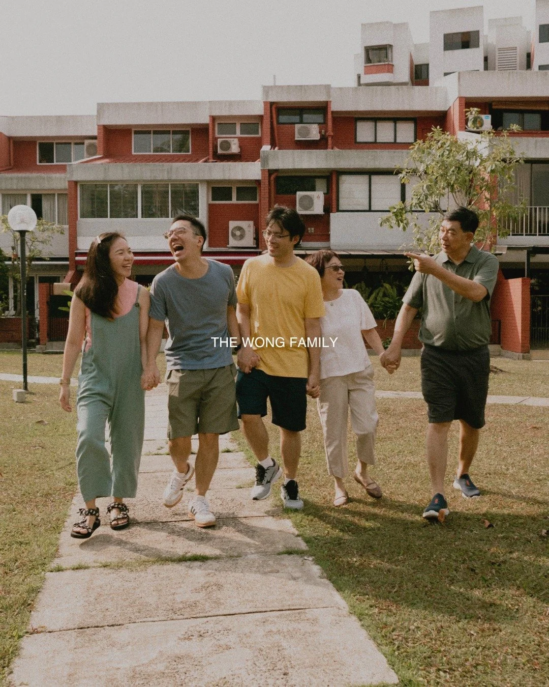a family walk that turned into a keepsake. 
hands finding hands, kids orbiting the grown ups. 
home in the background, history in the in between. 
soft direction, honest moments, nothing forced. 

#familyphotography #singaporefamilyphotographer #sgfa