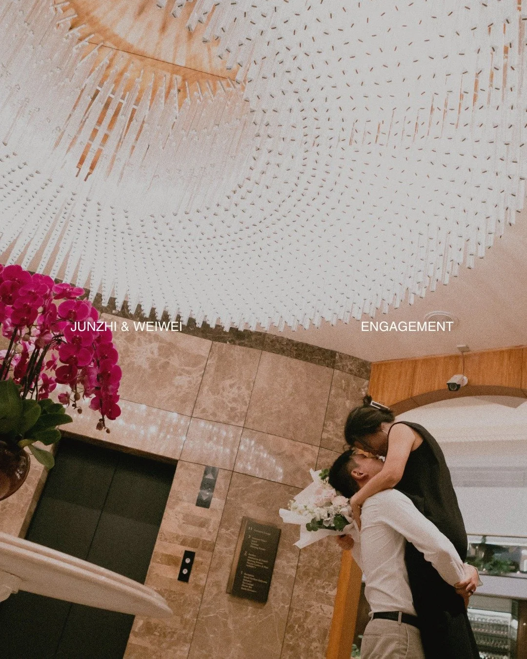 some moments ask to be kept gently. 
junzhi and weiwei, after the question, after the yes. 
hands close, flowers held, the city moving quietly around them. 
a simple promise, carried in the way they looked at each other. 

#singaporeengagement #propo