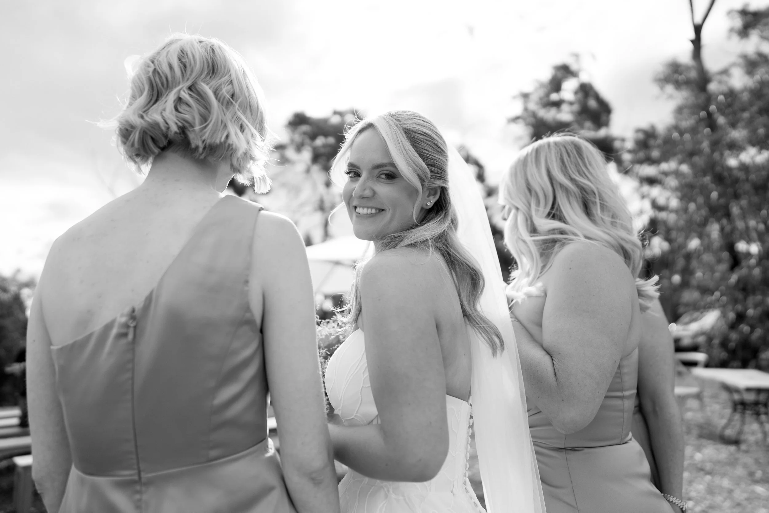 Sydney wedding hairstylist creates soft glam waves, half up half down hairstyle for bride at Caoura Cliffs in the Southern Highlands