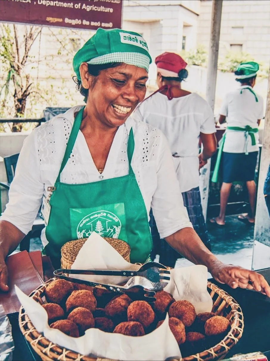 Visiting a traditional women-run food court, Hela Bojun Hala, in Kandy was one of the true highlights of our recent trip to Sri Lanka. Initiated and supported by the Ministry of Agriculture, Hela Bojun Hala provides a place for women to cook and sell