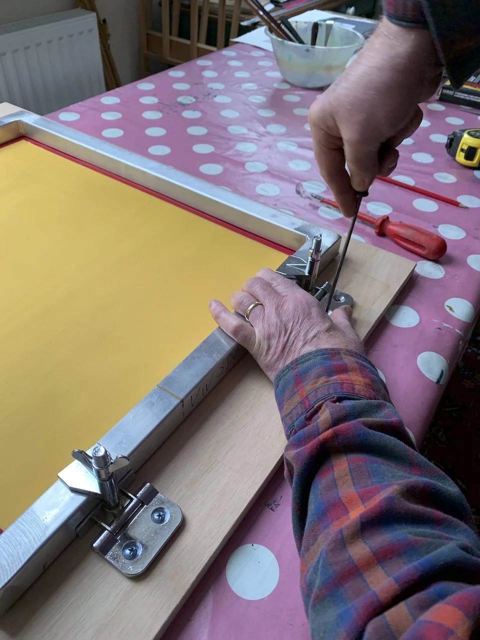 Andy makes me a hinged screen print frame.jpeg