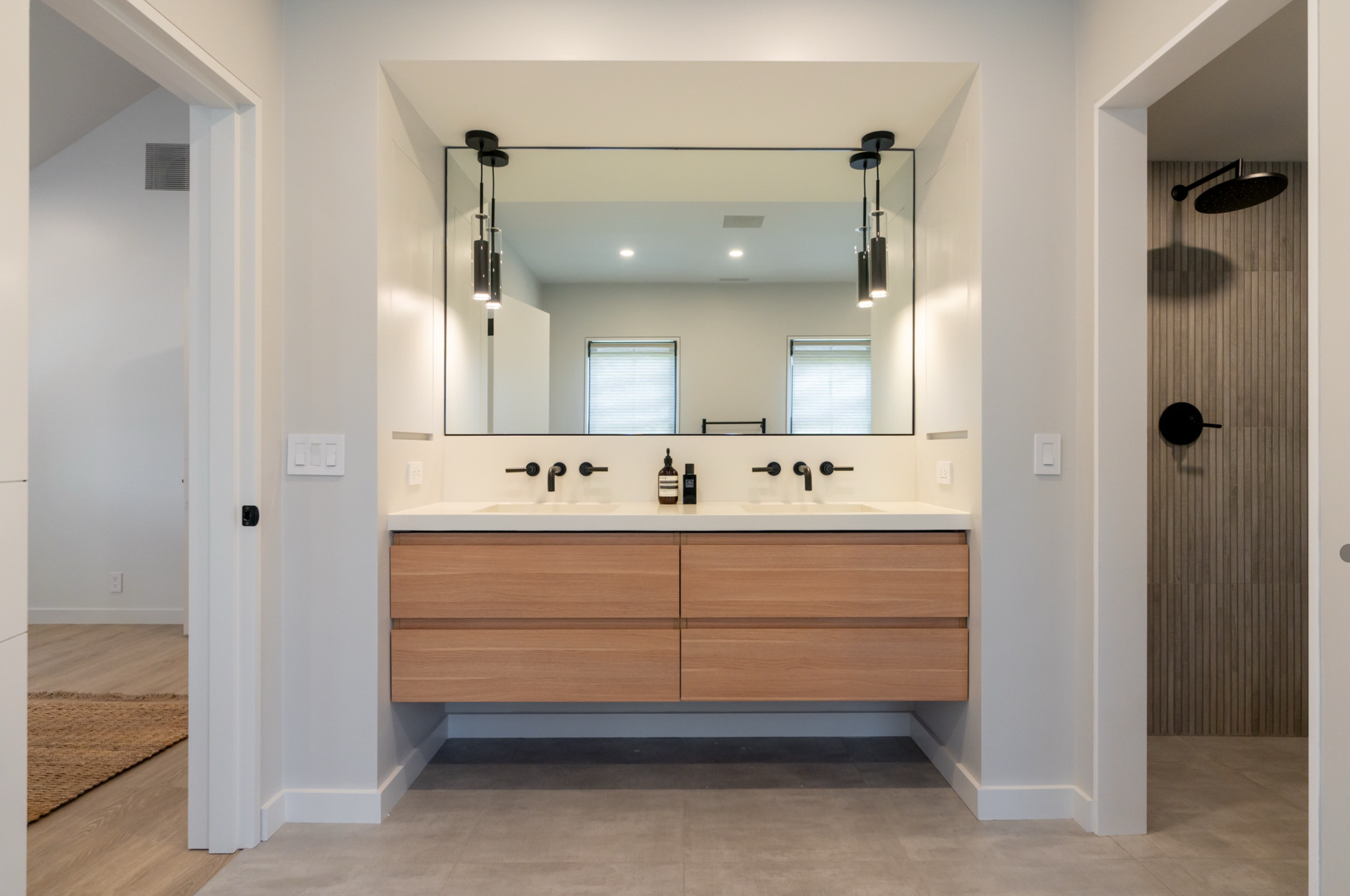 Custom bathroom vanity and walk-in shower located in downtown Nantucket by J.Martinson Builders