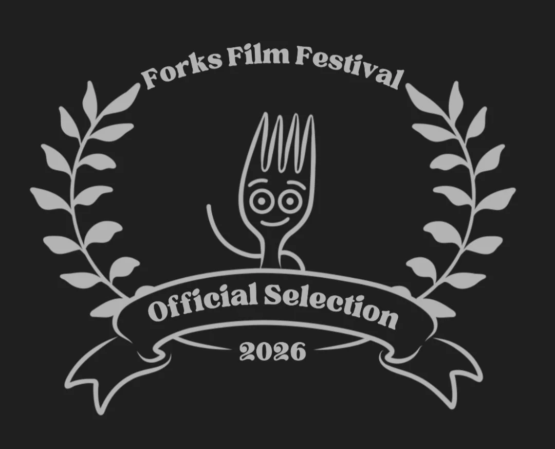 Logo for the Forks Film Festival, featuring a cartoon fork with a smiling face, surrounded by laurel branches, with text reading 'Forks Film Festival Official Selection 2026'.