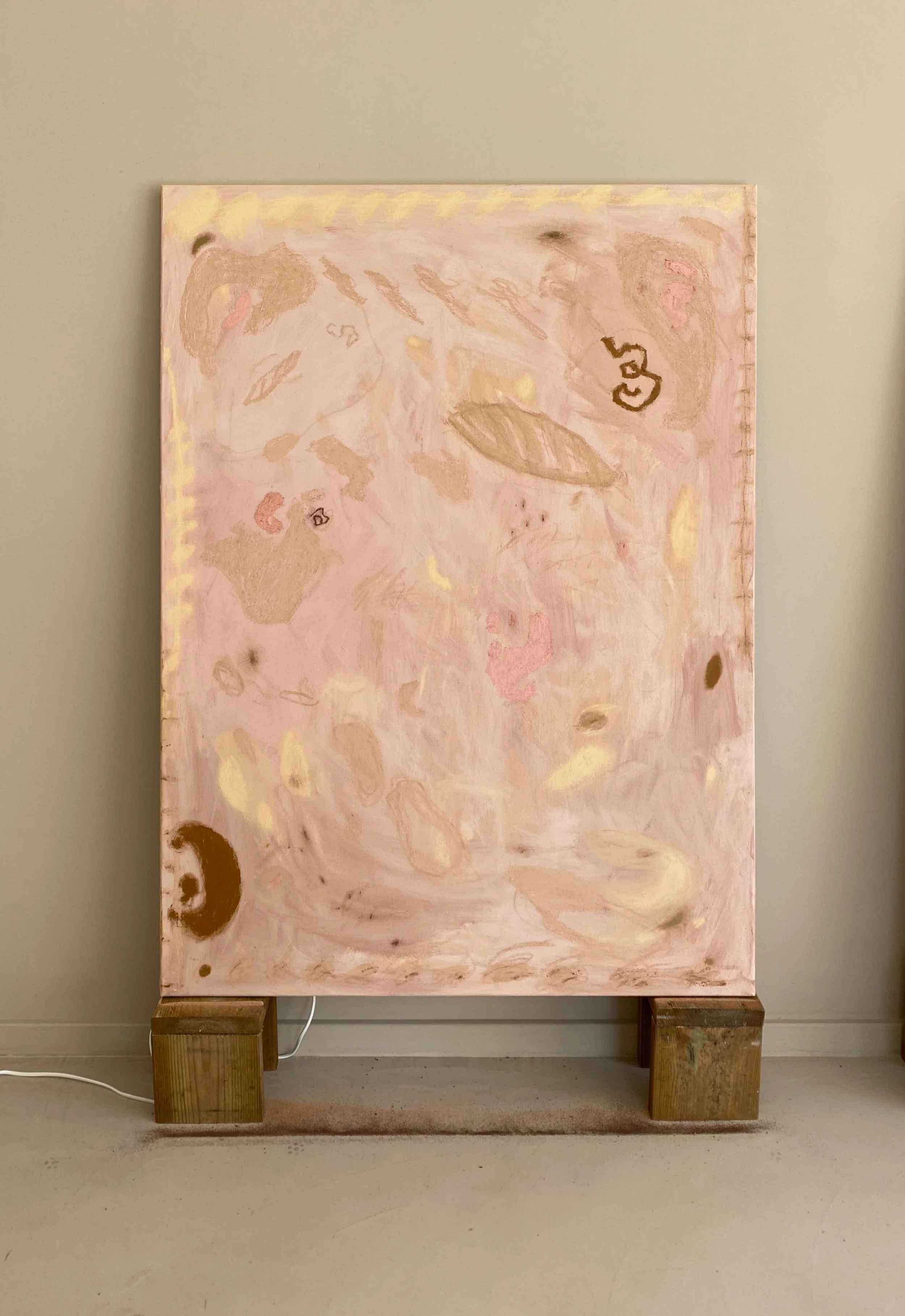 Abstract pink and beige painting on canvas, mounted on two wooden blocks, with minimal details and soft tones.