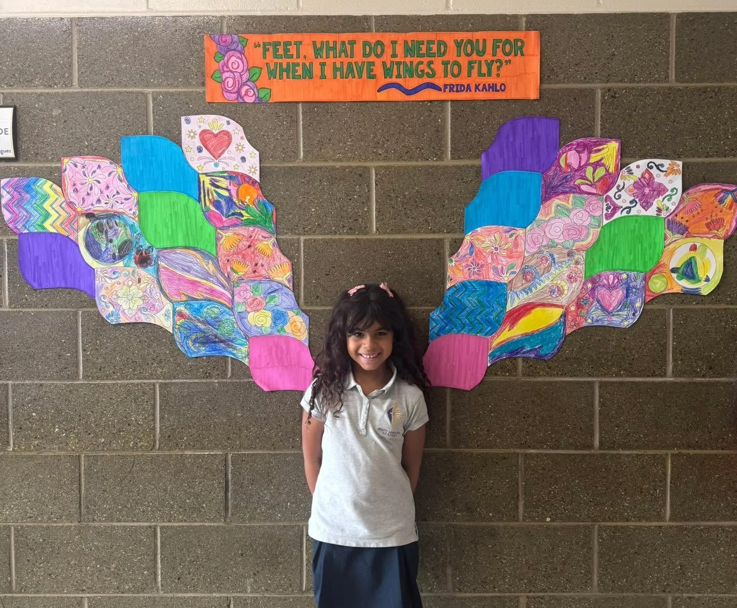 🕊️✨ In honor of #HispanicHeritageMonth, our first graders created a Frida Kahlo-inspired wing mural!
Each student designed a colorful &quot;Frida feather,&quot; and together they formed a beautiful set of wings around her powerful quote:
&quot;Feet,