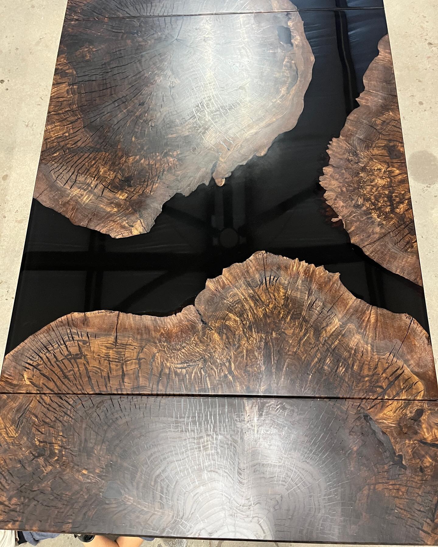 Check out this amazing Claro Walnut Burl table poured with our @ollogginepoxy LOGGIN2 first we poured 1&rdquo; with black pigment and let that cure. Then we poured the rest with clear so you can see the depth and the burls in the epoxy. We then finis