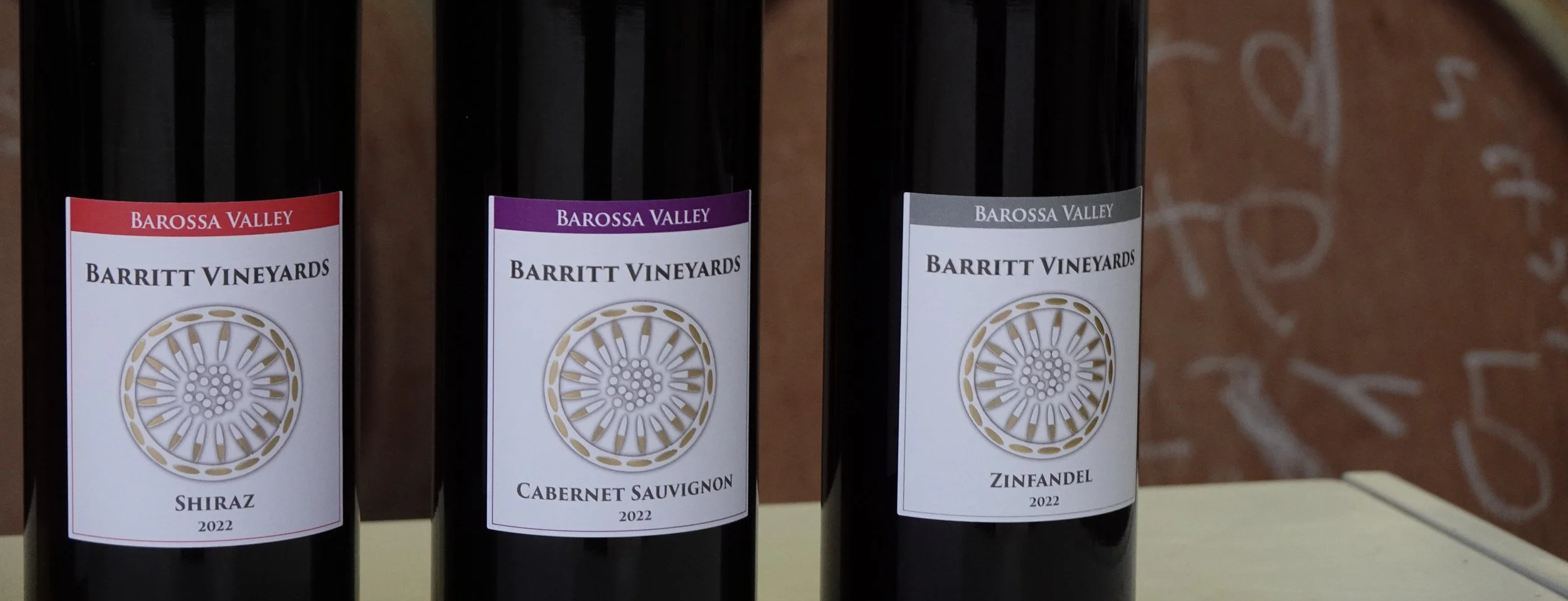 Barritt Vineyards wine bottles line-up showcasing 2022 Shiraz, Cabernet Sauvignon, and Zinfandel.