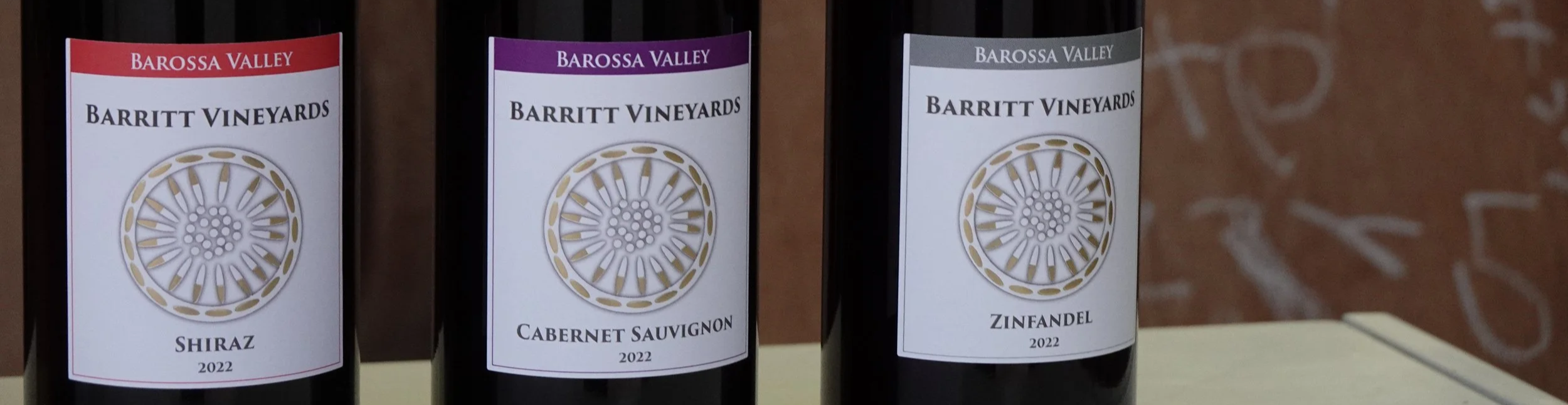 Barritt Vineyards wine bottles line-up showcasing 2022 Shiraz, Cabernet Sauvignon, and Zinfandel.