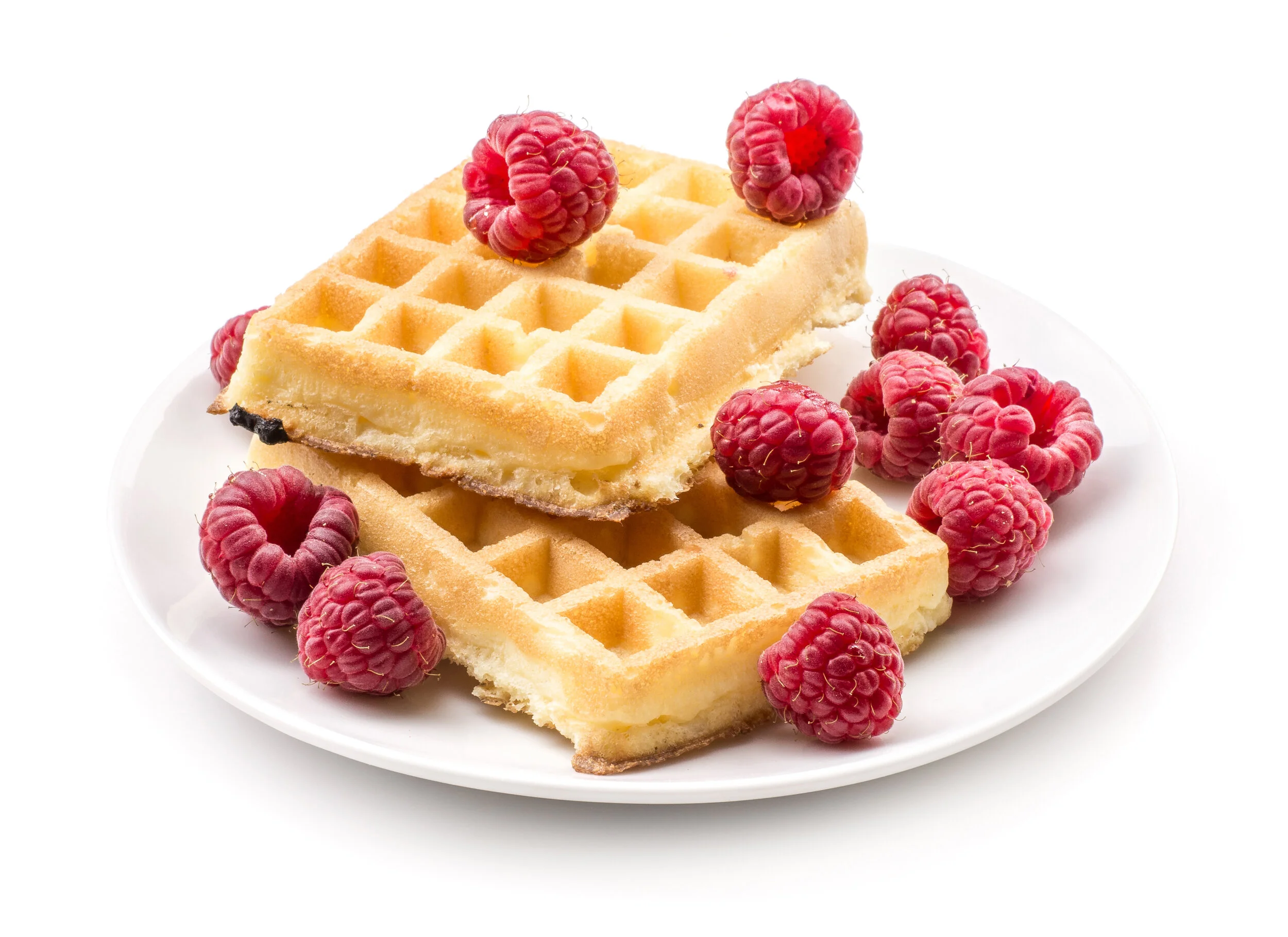 Waffles with raspberries on a white plate 
