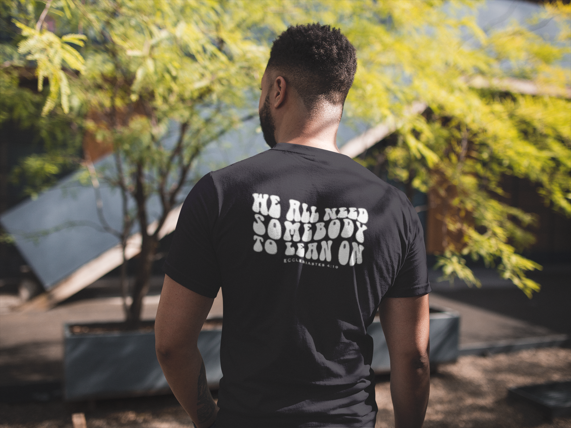 back-view-tshirt-mockup-of-a-man-facing-a-house-and-a-tree-21347.png