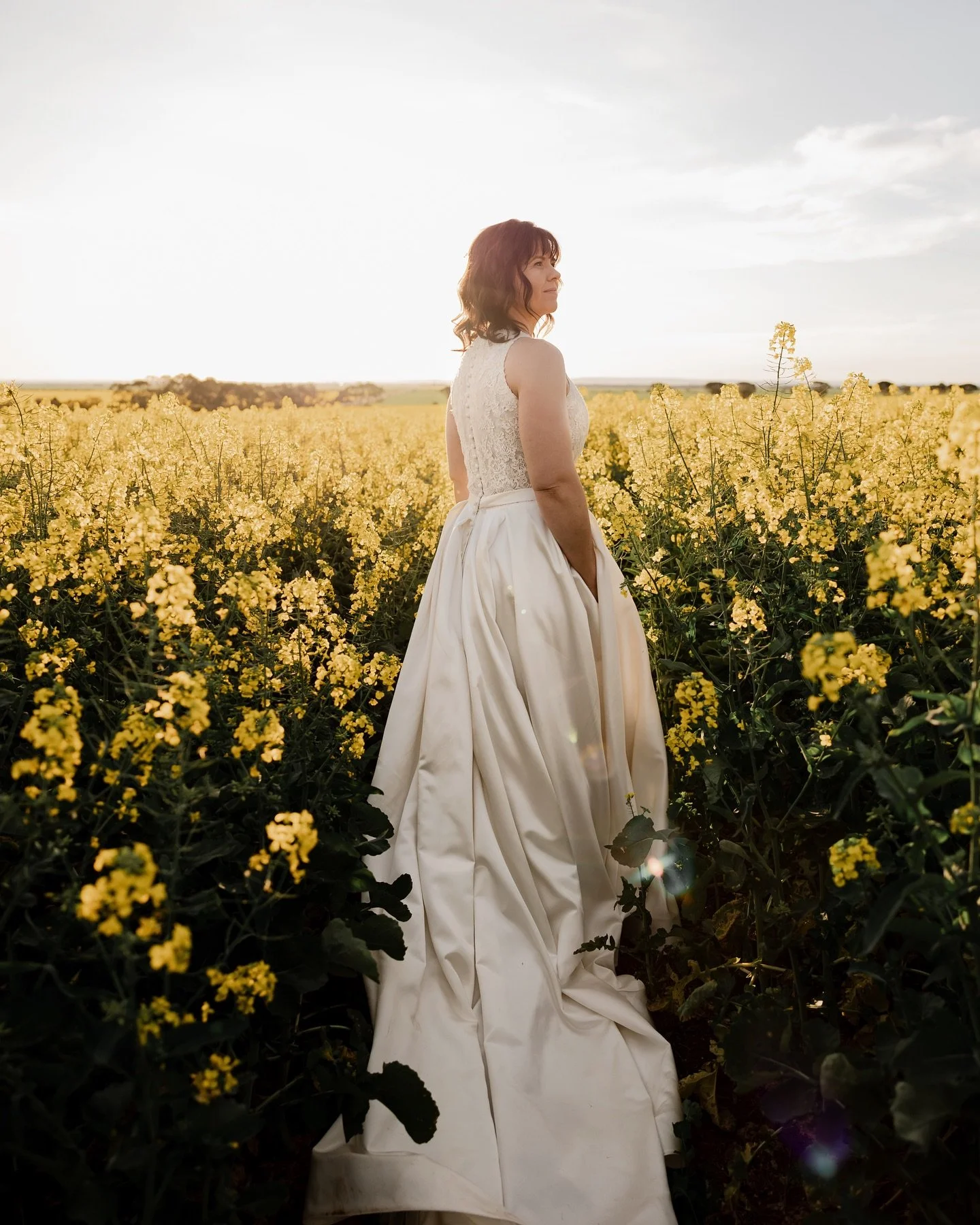Back to last years canola with our divine bride Tegan swapping out her cricket whites for her wedding whites 👰🏻&zwj;♀️🌼

The seeds just going into soil but blink and we&rsquo;ll be back to these warm glowing fields. 

#bride #wedding #love #weddin