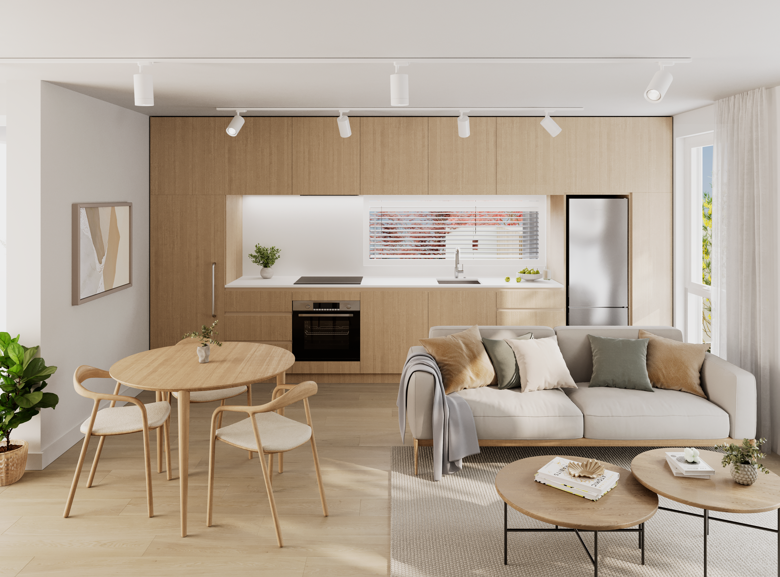 Modern, minimalist living room and kitchen with wooden cabinets, white walls, a gray sofa with pillows, a round wooden dining table with chairs, and two round coffee tables with books and decorative objects, illuminated by natural light from large wi