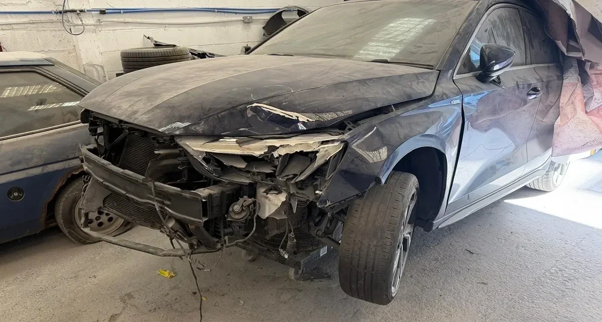 Car with extreme damage at CPR Liverpool Body Shop