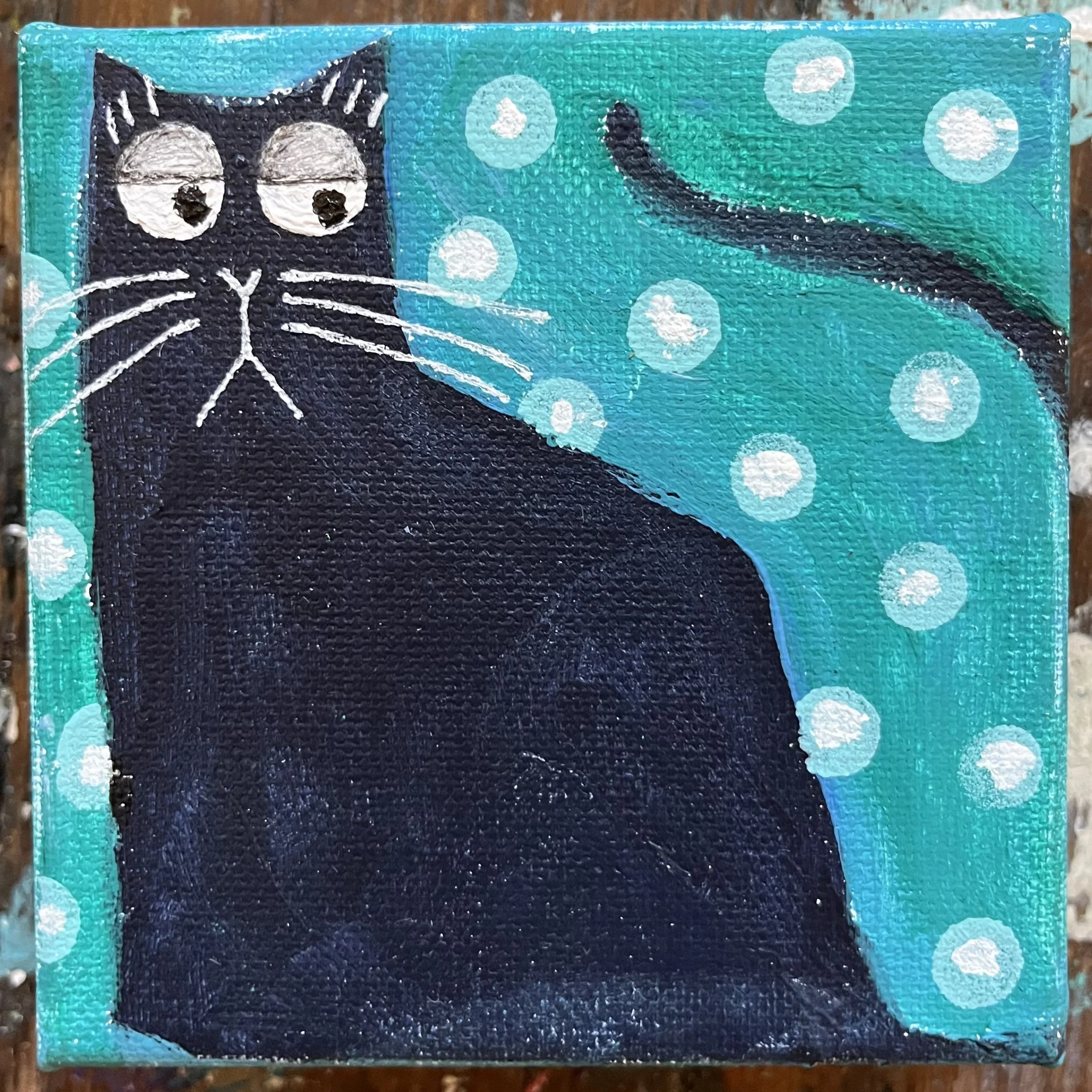 Original 4x4 inch acrylic painting of a black cat named Carlin with wide, skeptical eyes against a teal background with white polka dots.