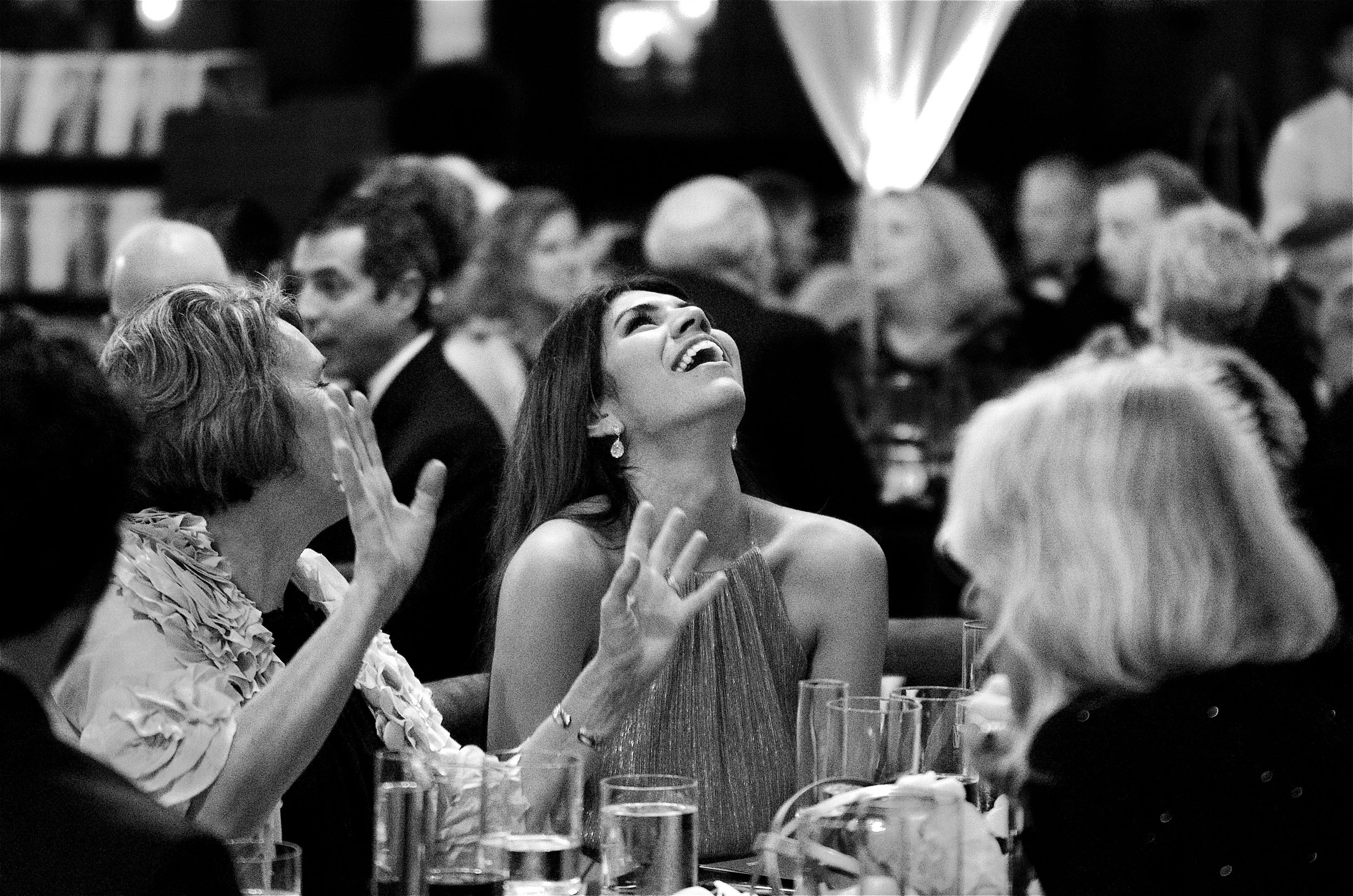Women having a laugh at the North Carolina Symphony Gala