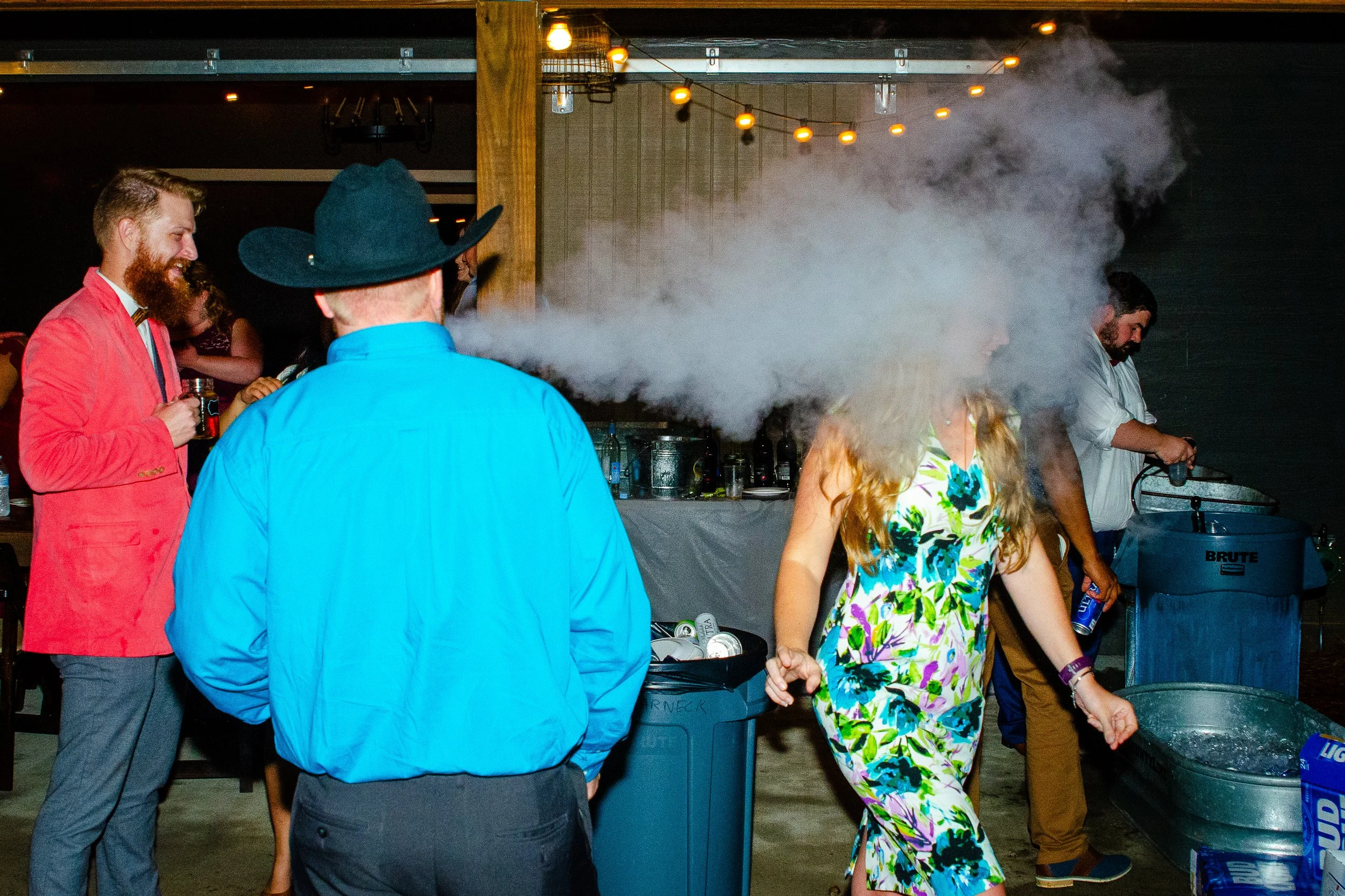 Man vaping and blowing smoke at a woman..jpg