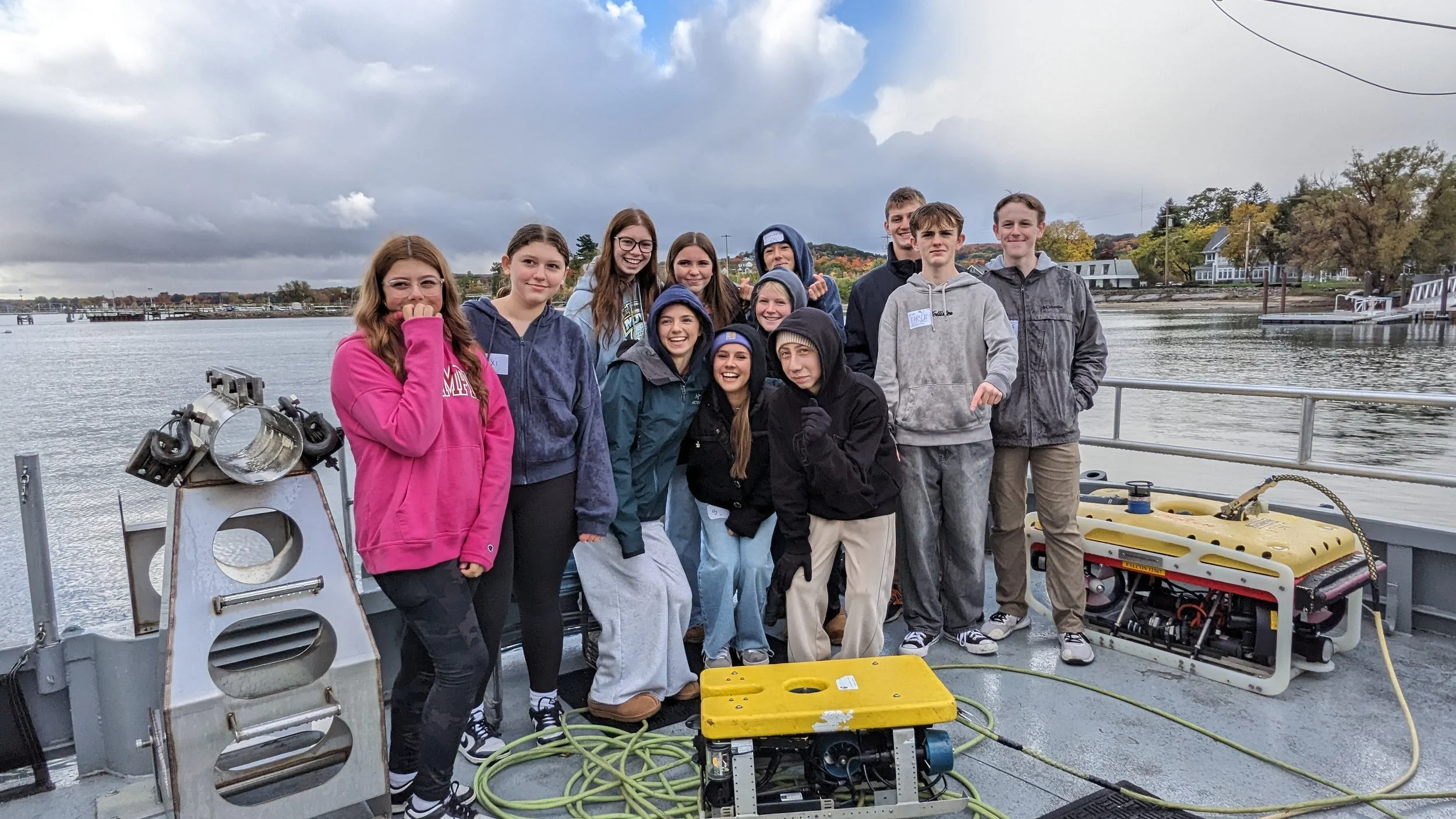 Twelve students pose with an underwater ROV