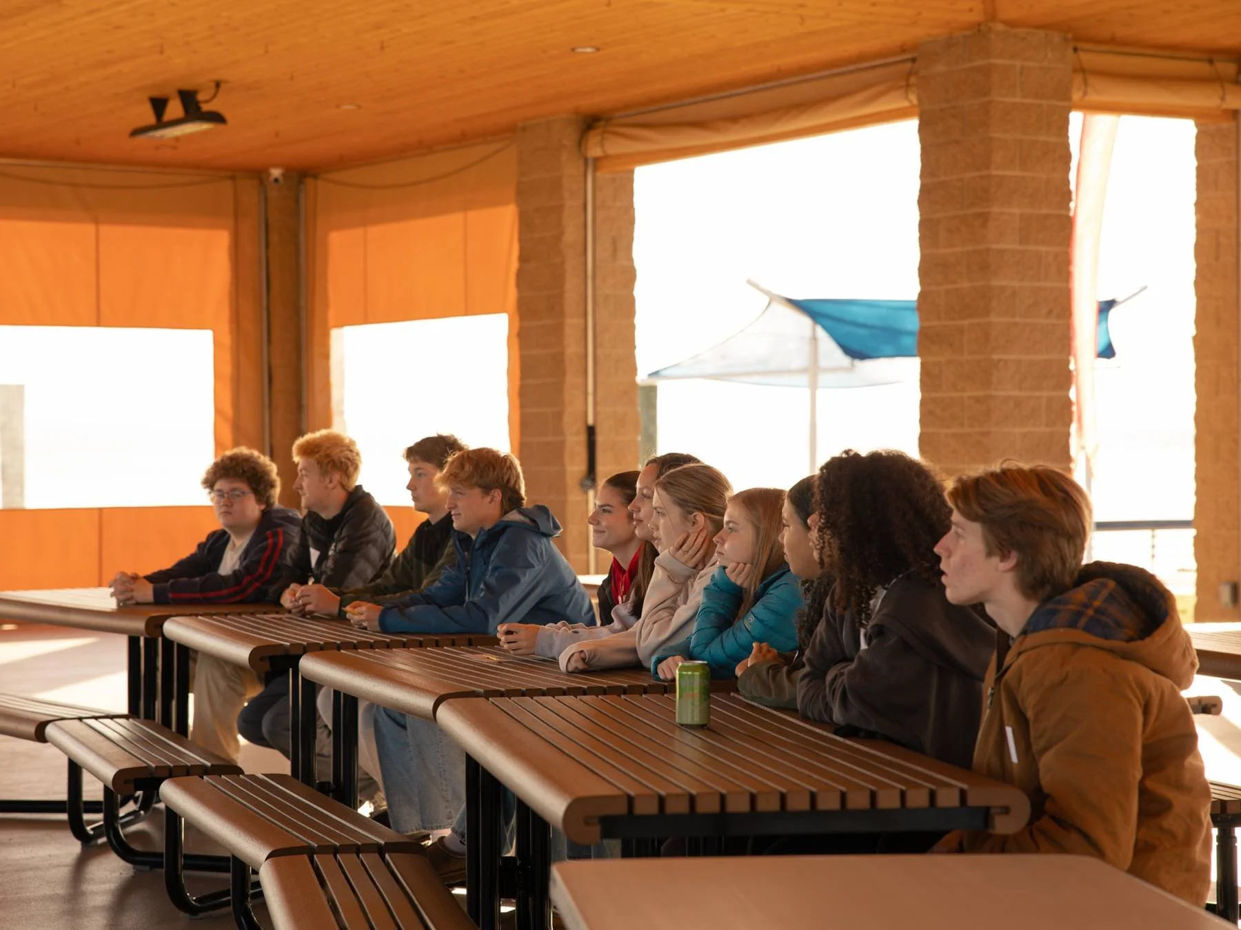 Students sit while listening to a presentation