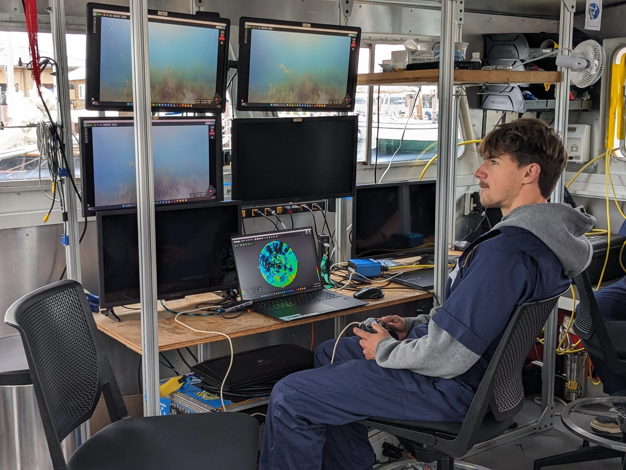 A student uses a controller to fly an ROV