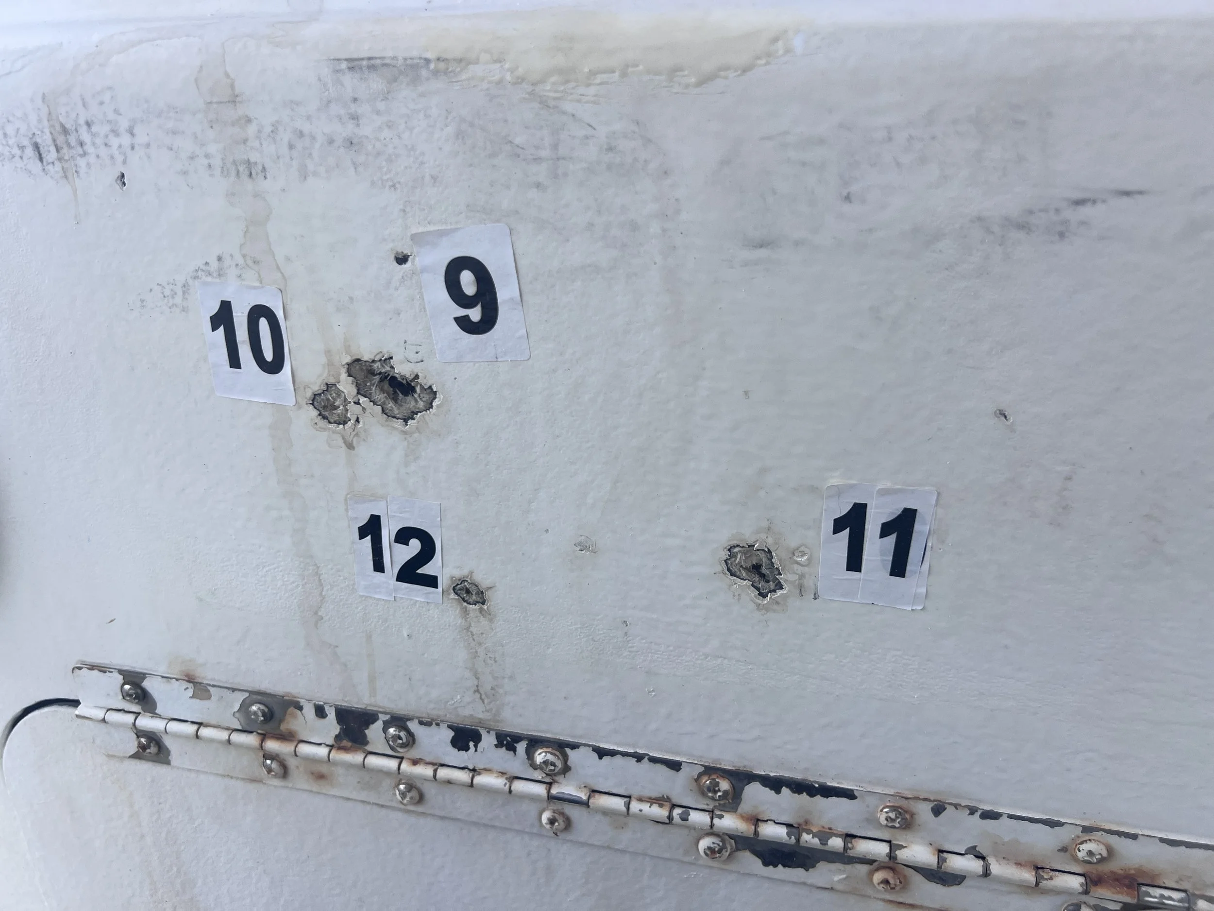 El Tornado, the 24-foot Florida fishing boat used by the group to travel to Cuba. Investigators documented 23 impacts on the fishing boat and 14 on the Cuban Border Guard vessel.
