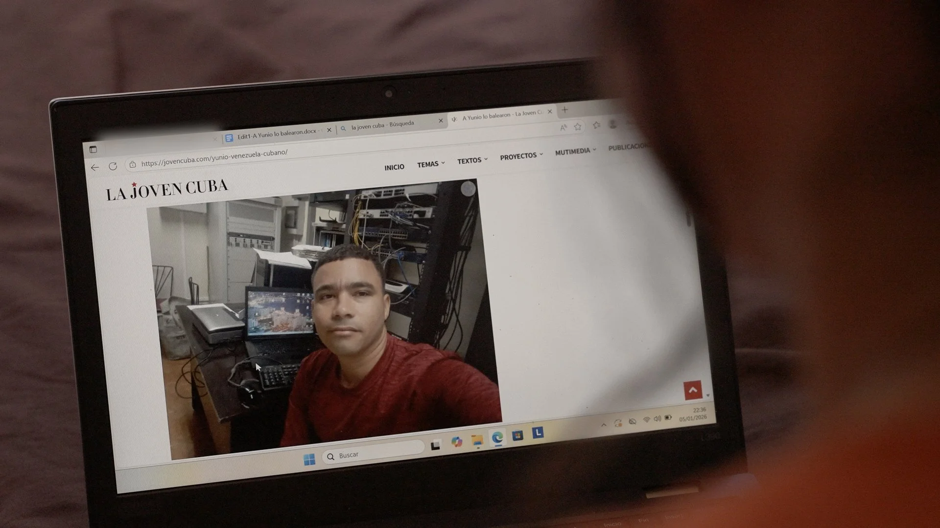 Photo of Yunio displayed on a laptop screen on Claudia’s computer, shown during an interview with his friend.