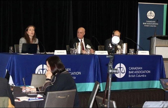 Rebecca, Judge, and Crown counsel at the speakers table