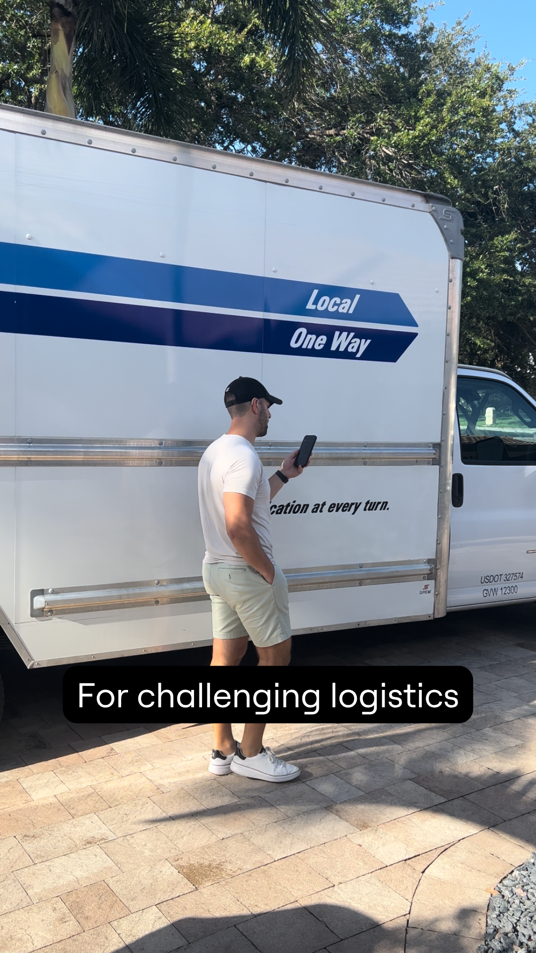 Dustin using his iPhone for a captioned phone call. Text says, "For challenging logistics""