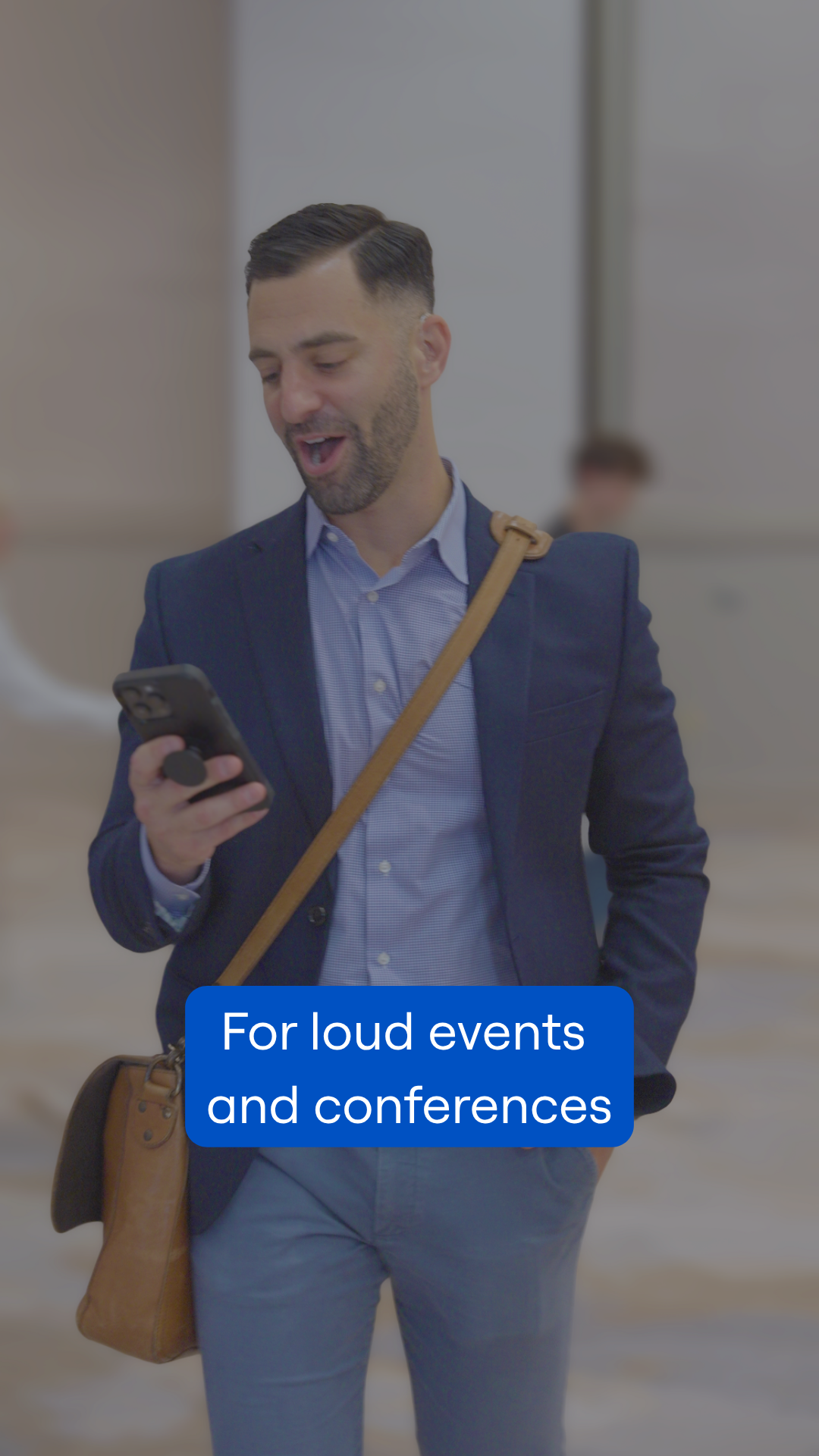Dustin using his iPhone for a captioned phone call. Text says, "For loud events and conferences"