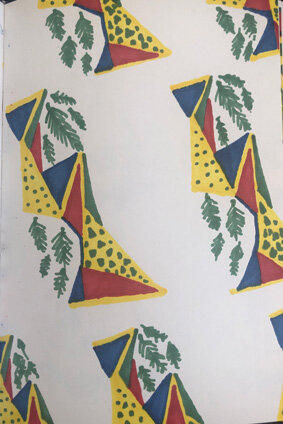 Pattern featuring stylized yellow giraffes with green spots and blue and red accents, along with green palm leaves on a white background.