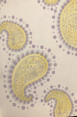 Illustration of yellow paisley shapes with purple dotted borders on a white background.