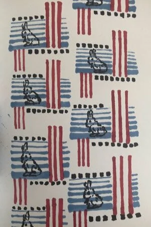 Pattern of black bicycles over red and blue stripes on a white background.