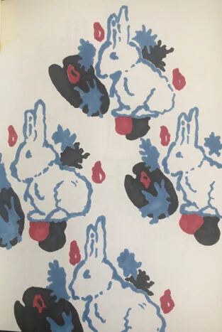 Pattern of stylized rabbits with abstract shapes in black, white, blue, and red.