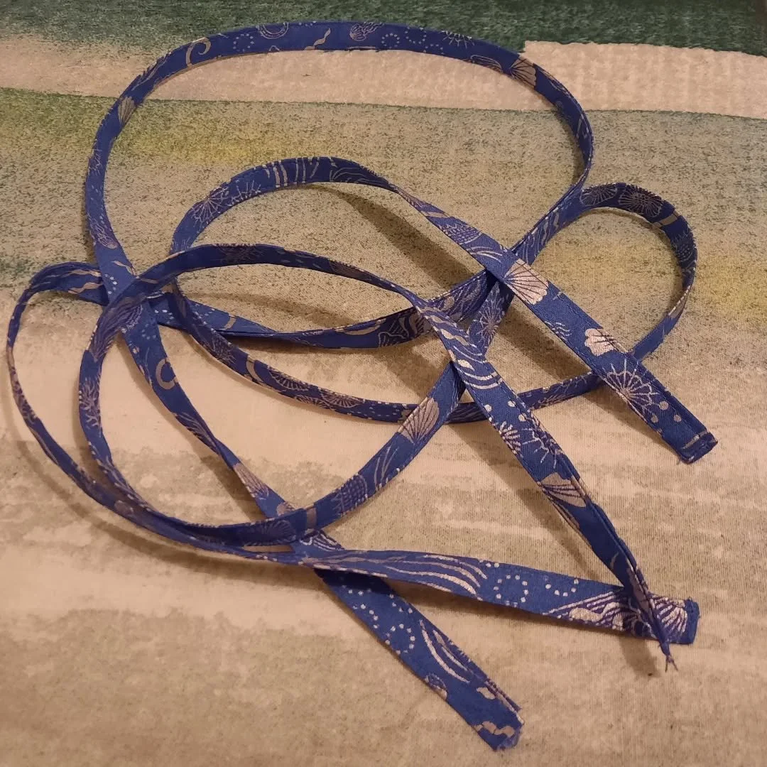 Sewing straps first thing in the morning? Brain said no. Sewing straps at 8.30 pm? Heck yes! Apparently?! Brain is brain sometimes. Straps done for my dress, though!

Image Description: Two thin fabric straps are on a strewn pile. They are sewn in a 